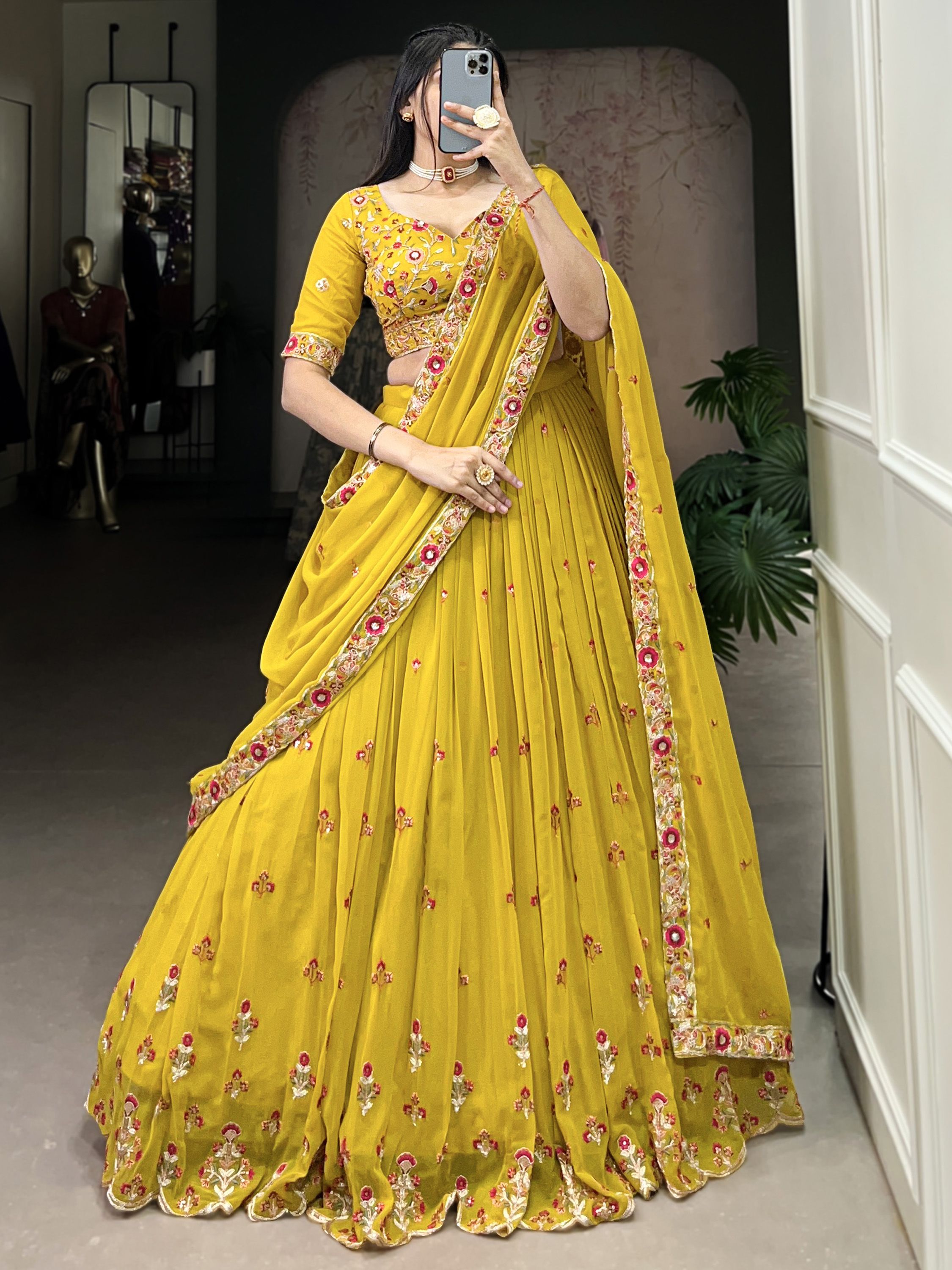 Neeva Yellow Thread Embroidered Georgette Lehenga Choli, perfect for Haldi ceremonies. This vibrant ensemble features intricate thread embroidery on soft georgette fabric, exuding elegance and festive charm. Paired with a beautifully designed choli and a matching dupatta, this lehenga set is a stunning choice for wedding celebrations and special occasions