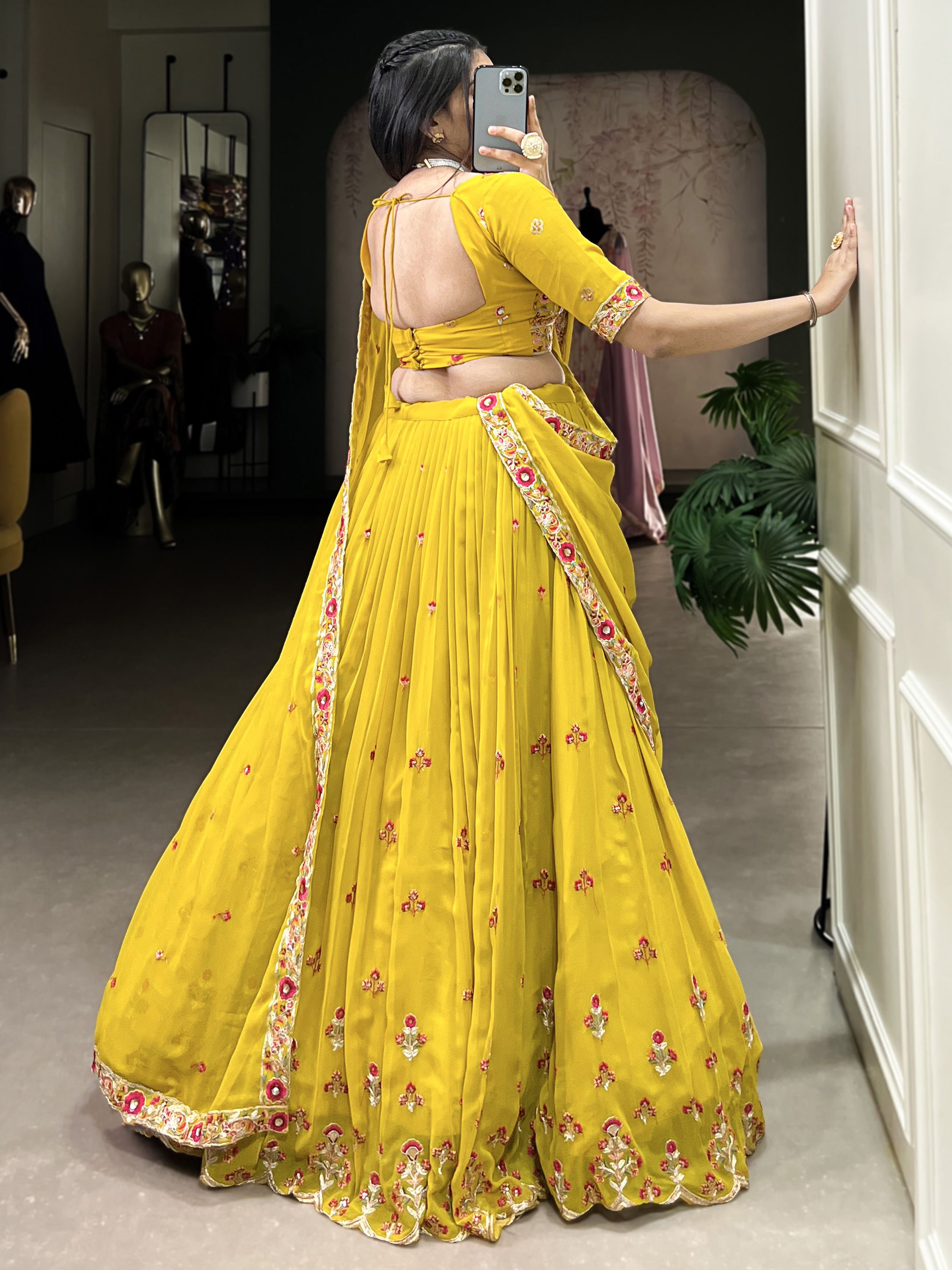 Neeva Yellow Thread Embroidered Georgette Lehenga Choli, perfect for Haldi ceremonies. This vibrant ensemble features intricate thread embroidery on soft georgette fabric, exuding elegance and festive charm. Paired with a beautifully designed choli and a matching dupatta, this lehenga set is a stunning choice for wedding celebrations and special occasions