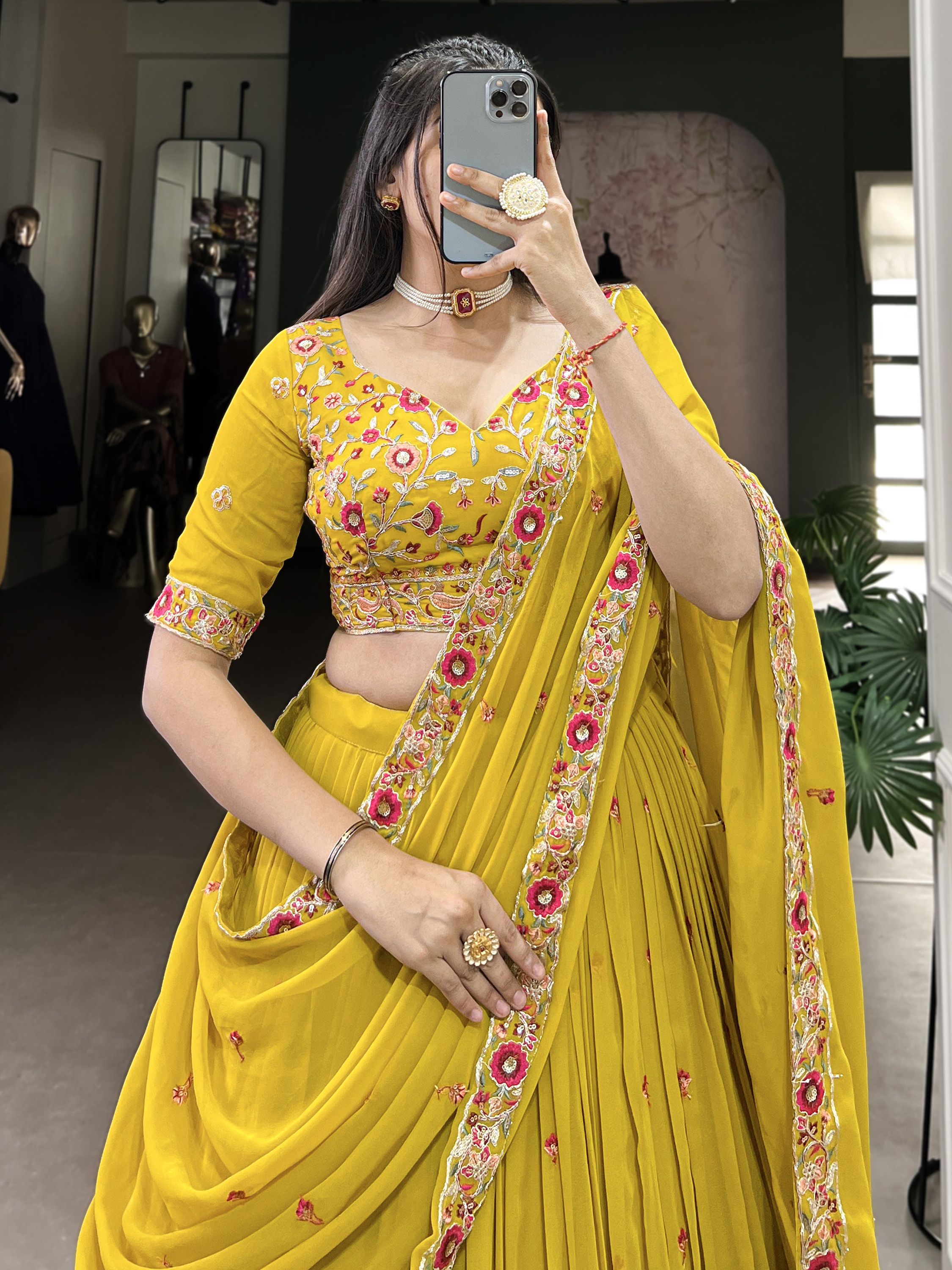 Neeva Yellow Thread Embroidered Georgette Lehenga Choli, perfect for Haldi ceremonies. This vibrant ensemble features intricate thread embroidery on soft georgette fabric, exuding elegance and festive charm. Paired with a beautifully designed choli and a matching dupatta, this lehenga set is a stunning choice for wedding celebrations and special occasions