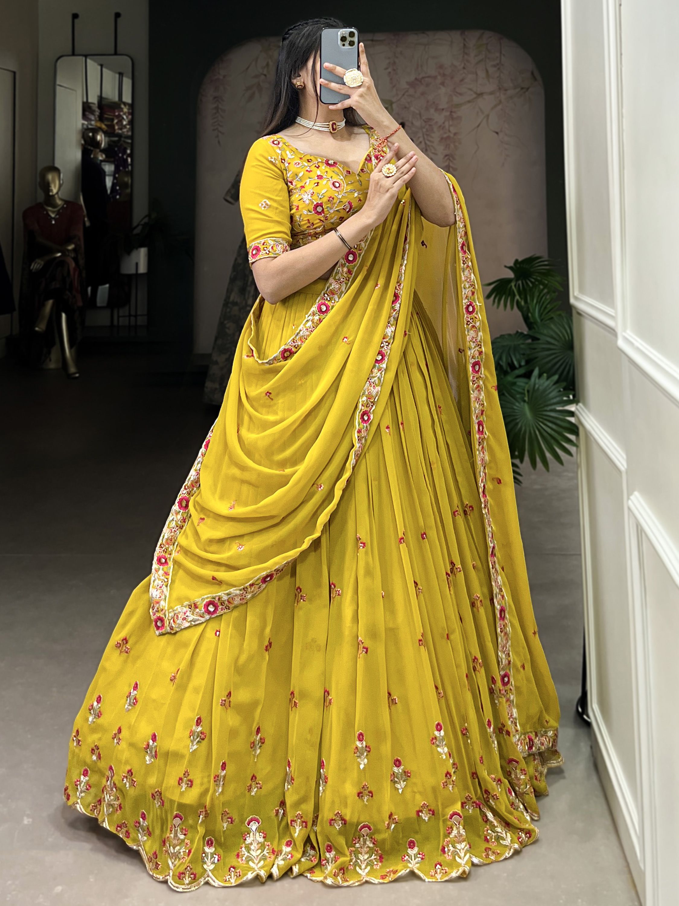 Neeva Yellow Thread Embroidered Georgette Lehenga Choli, perfect for Haldi ceremonies. This vibrant ensemble features intricate thread embroidery on soft georgette fabric, exuding elegance and festive charm. Paired with a beautifully designed choli and a matching dupatta, this lehenga set is a stunning choice for wedding celebrations and special occasions