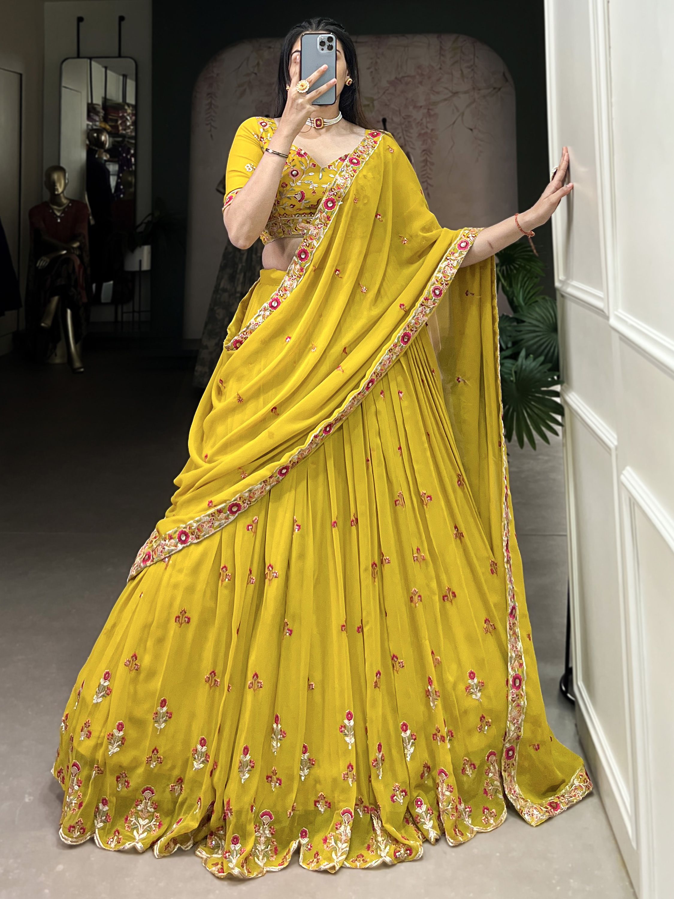 Neeva Yellow Thread Embroidered Georgette Lehenga Choli, perfect for Haldi ceremonies. This vibrant ensemble features intricate thread embroidery on soft georgette fabric, exuding elegance and festive charm. Paired with a beautifully designed choli and a matching dupatta, this lehenga set is a stunning choice for wedding celebrations and special occasions