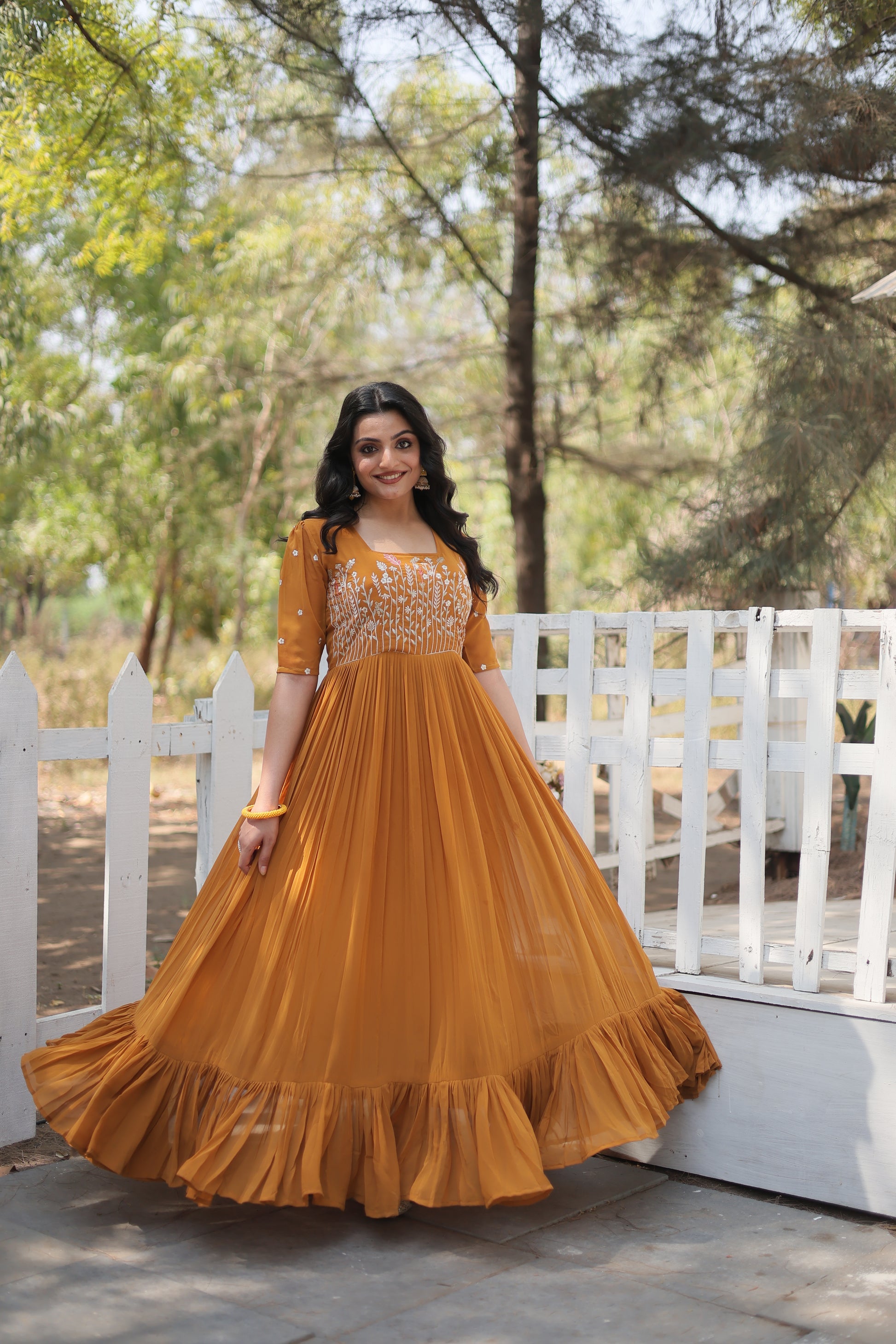 Nitara mustard yellow georgette embroidered Anarkali gown