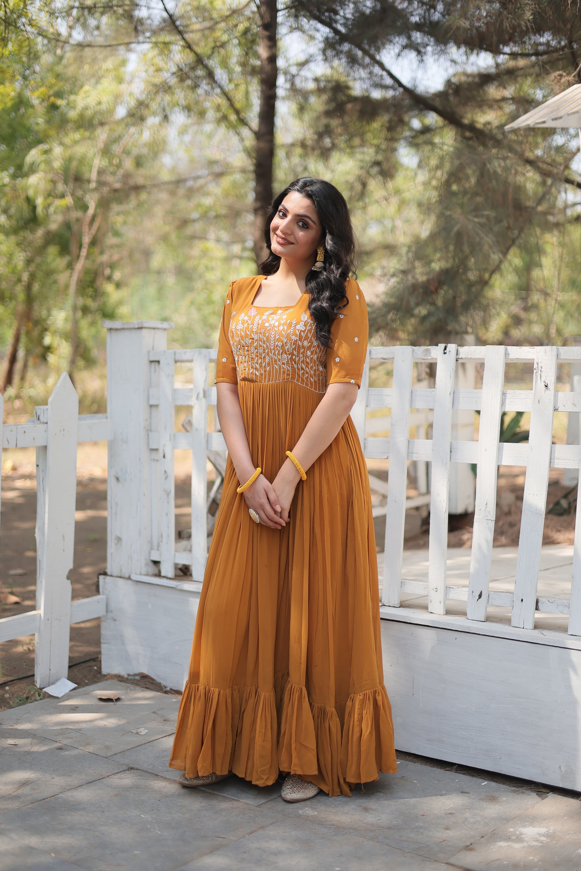 Nitara mustard yellow georgette embroidered Anarkali gown