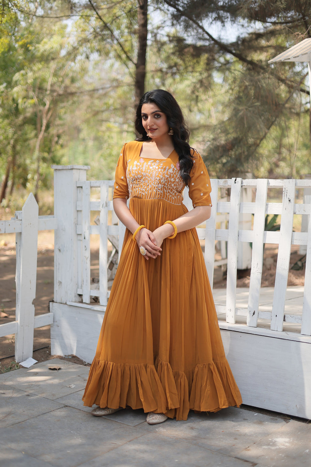 Nitara mustard yellow georgette embroidered Anarkali gown