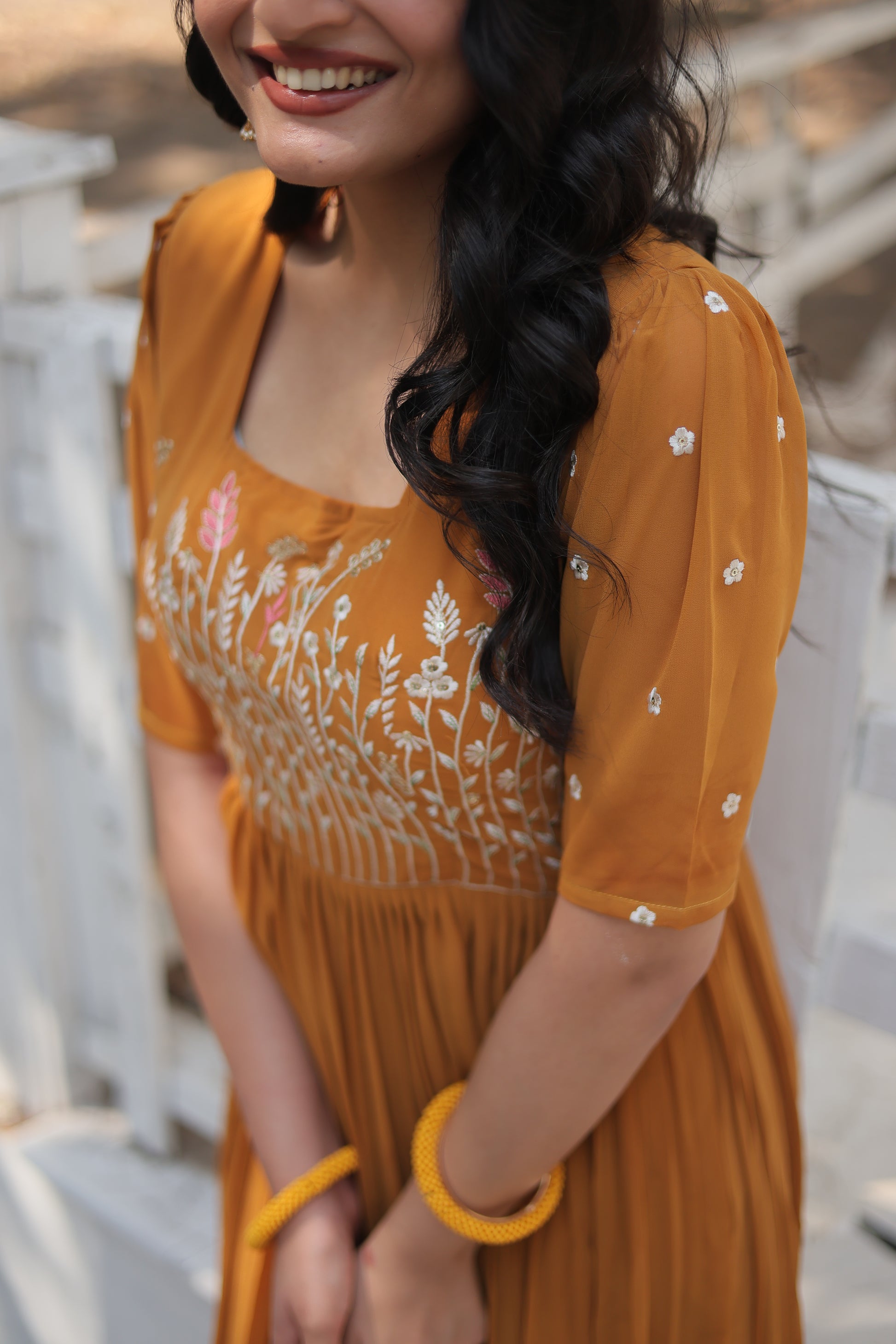 Nitara mustard yellow georgette embroidered Anarkali gown