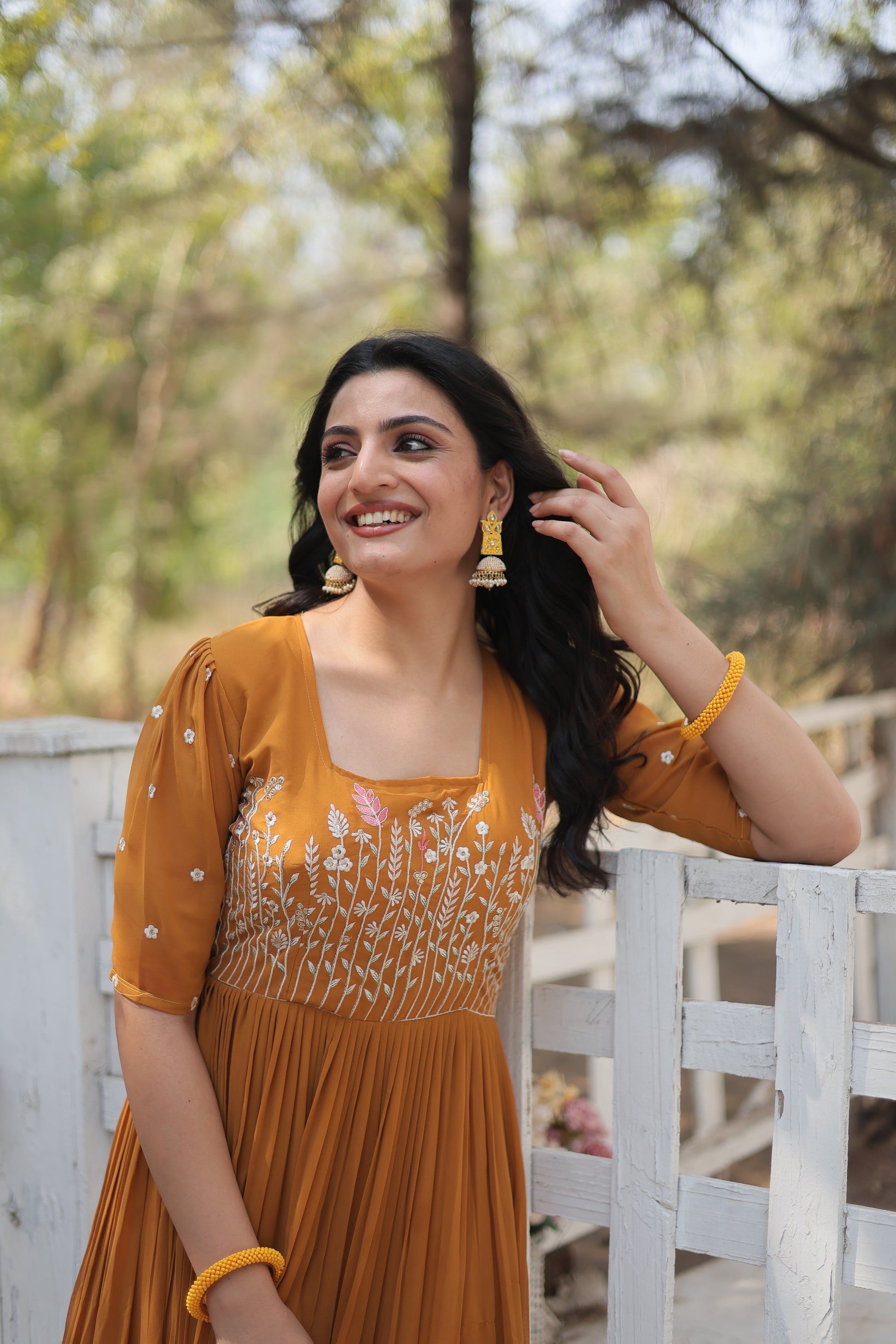 Nitara mustard yellow georgette embroidered Anarkali gown