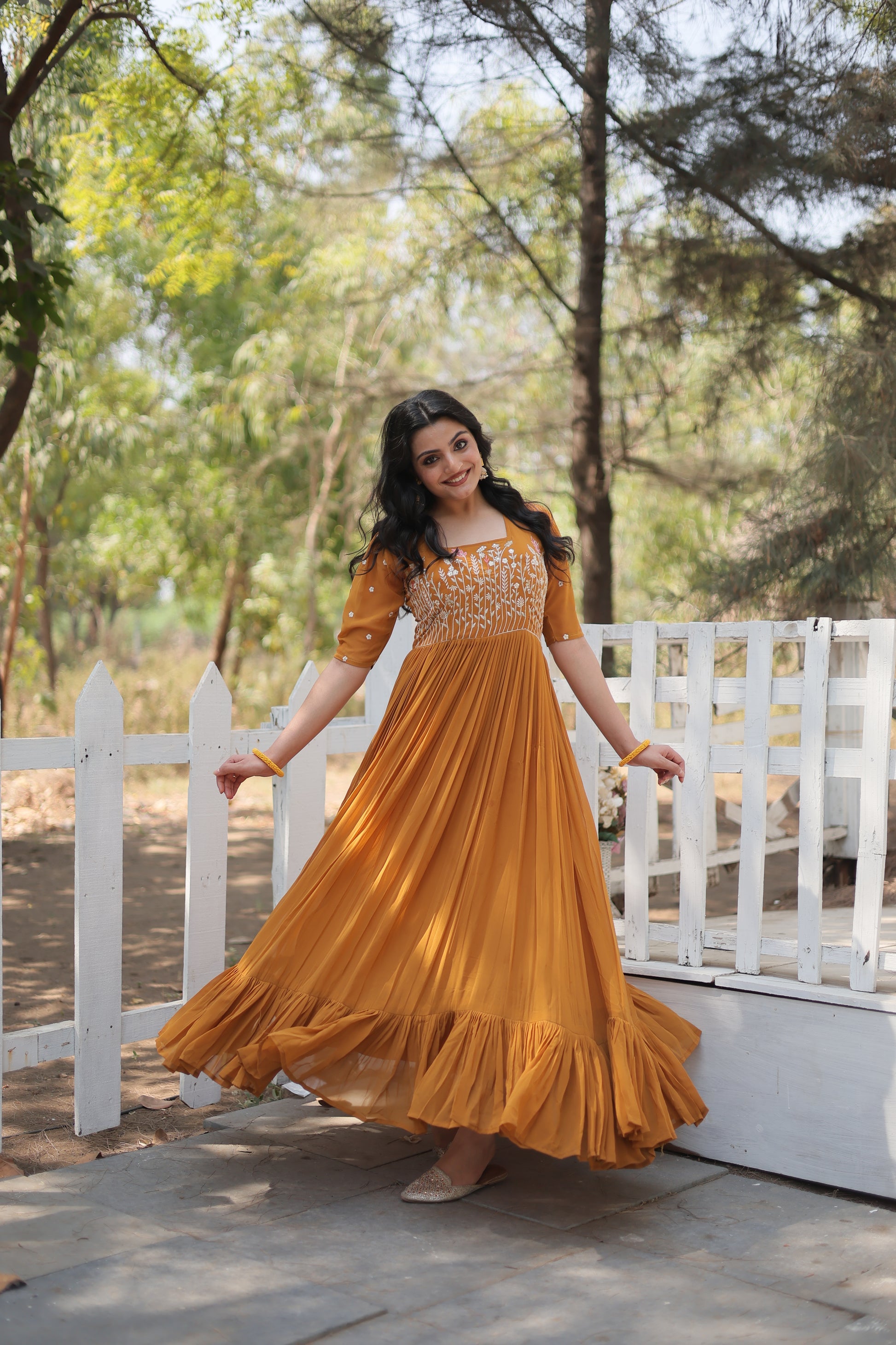 Nitara mustard yellow georgette embroidered Anarkali gown