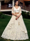 Off white net sequins embroidered party wear lehenga choli