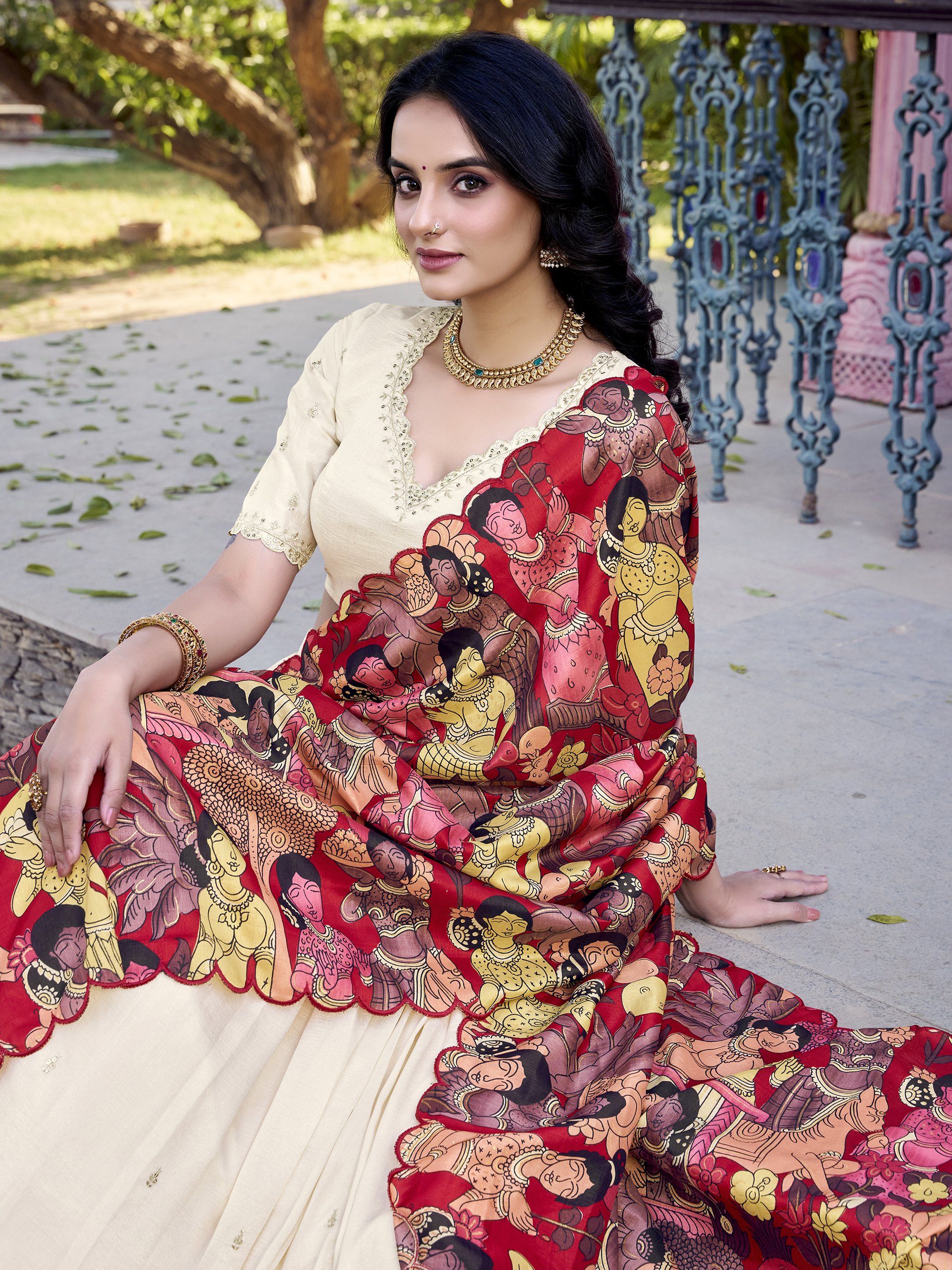 Off-white Vichitra silk lehenga choli with intricate sequin and thread embroidery, 4-meter flair, Kalamkari printed dupatta with scalloped border – a premium festive outfit for weddings and traditional celebrations