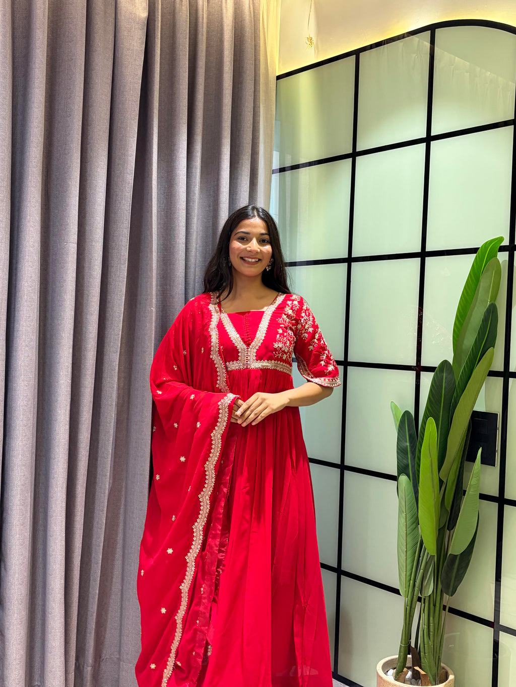 Royal Ruby Red Embroidered Anarkali Gown with Elegant Gold Lace Border and Floral Sleeve Detailing