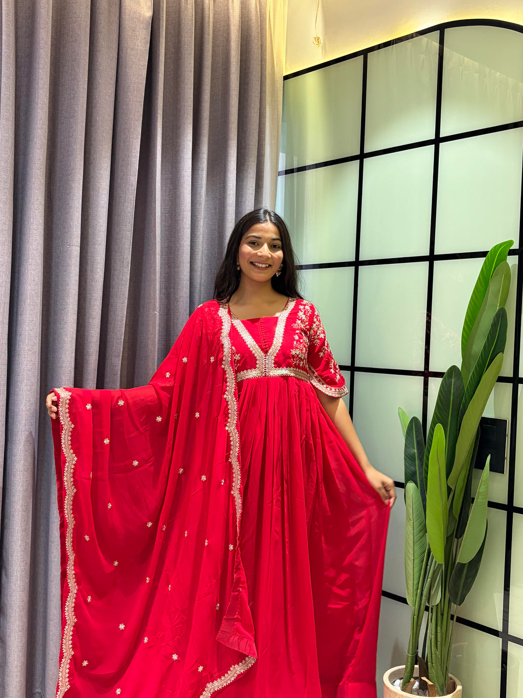 Royal Ruby Red Embroidered Anarkali Gown with Elegant Gold Lace Border and Floral Sleeve Detailing