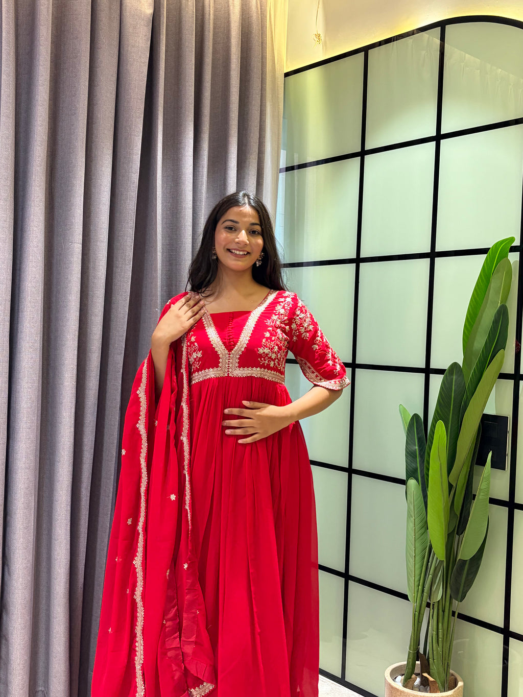 Royal Ruby Red Embroidered Anarkali Gown with Elegant Gold Lace Border and Floral Sleeve Detailing