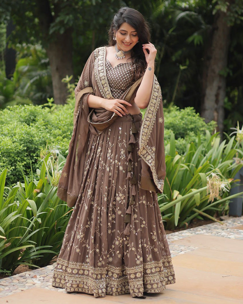 Rasika Brown Embroidered Designer Lehenga Choli with Heavy Sequins Work, Faux Blooming Fabric, and Faux Georgette Dupatta – Perfect for Weddings & Festive Wear.
