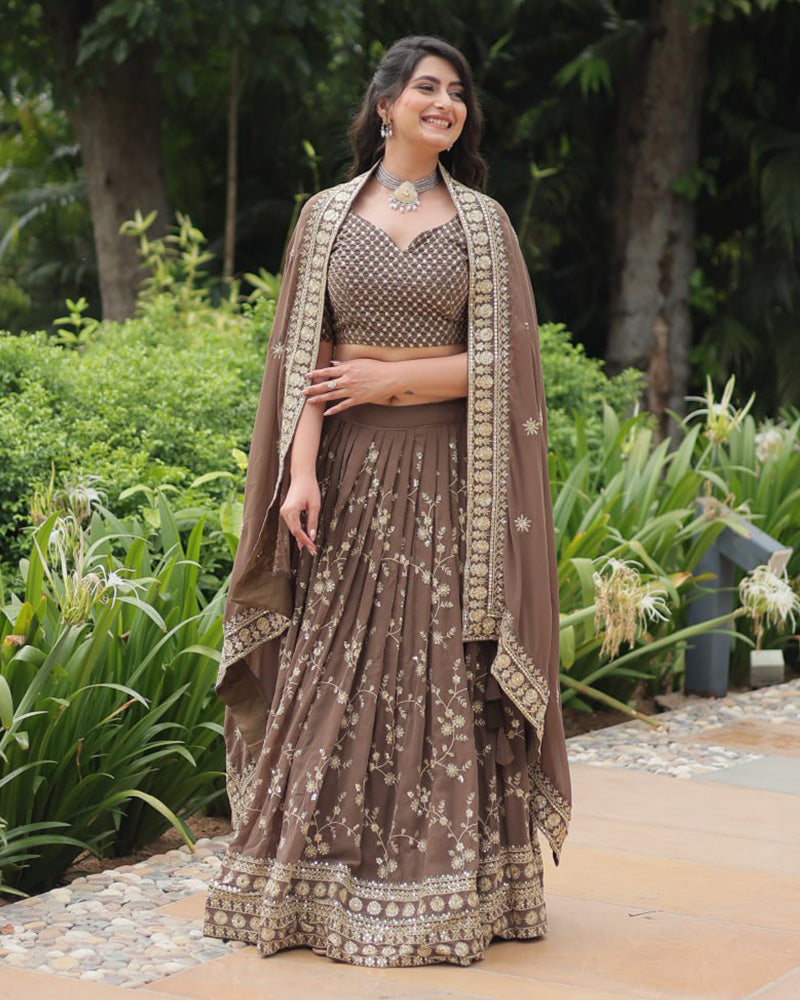 Rasika Brown Embroidered Designer Lehenga Choli with Heavy Sequins Work, Faux Blooming Fabric, and Faux Georgette Dupatta – Perfect for Weddings & Festive Wear.
