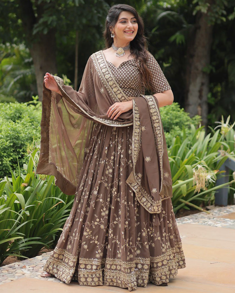Rasika Brown Embroidered Designer Lehenga Choli with Heavy Sequins Work, Faux Blooming Fabric, and Faux Georgette Dupatta – Perfect for Weddings & Festive Wear.

