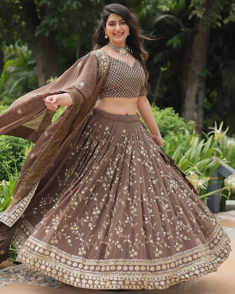 Rasika Brown Embroidered Designer Lehenga Choli with Heavy Sequins Work, Faux Blooming Fabric, and Faux Georgette Dupatta – Perfect for Weddings & Festive Wear.
