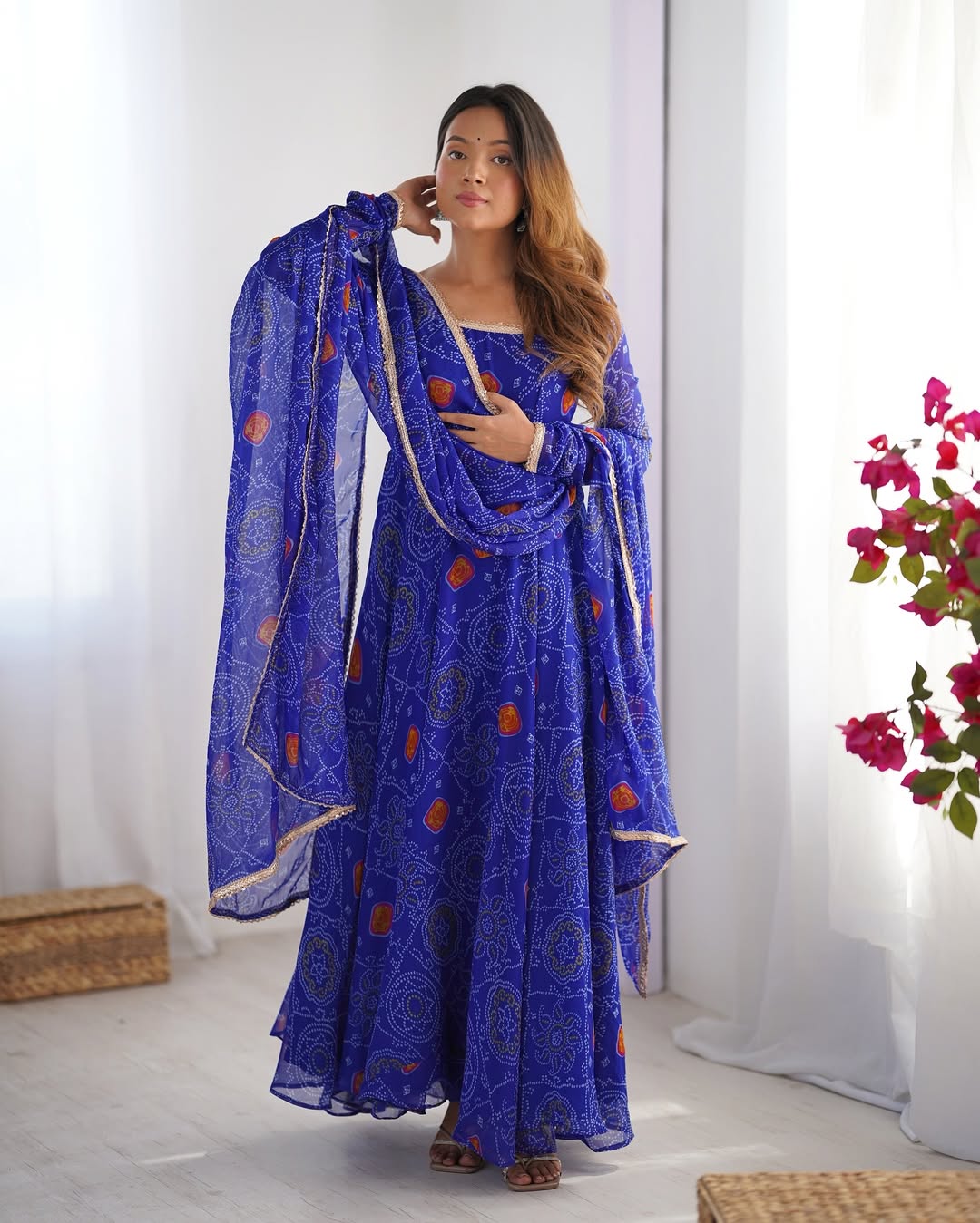 Shanvi Bandhej Chiffon Anarkali Suit Set – blue Bandhej Anarkali gown, traditional chiffon ethnic wear, women’s blue ethnic dress, Bandhej printed Anarkali for weddings, designer ethnic gown, Anarkali suit with lace dupatta, flair Anarkali with full sleeves, Bandhej print ethnic dress, blue festival wear gown, Indian wedding guest Anarkali.