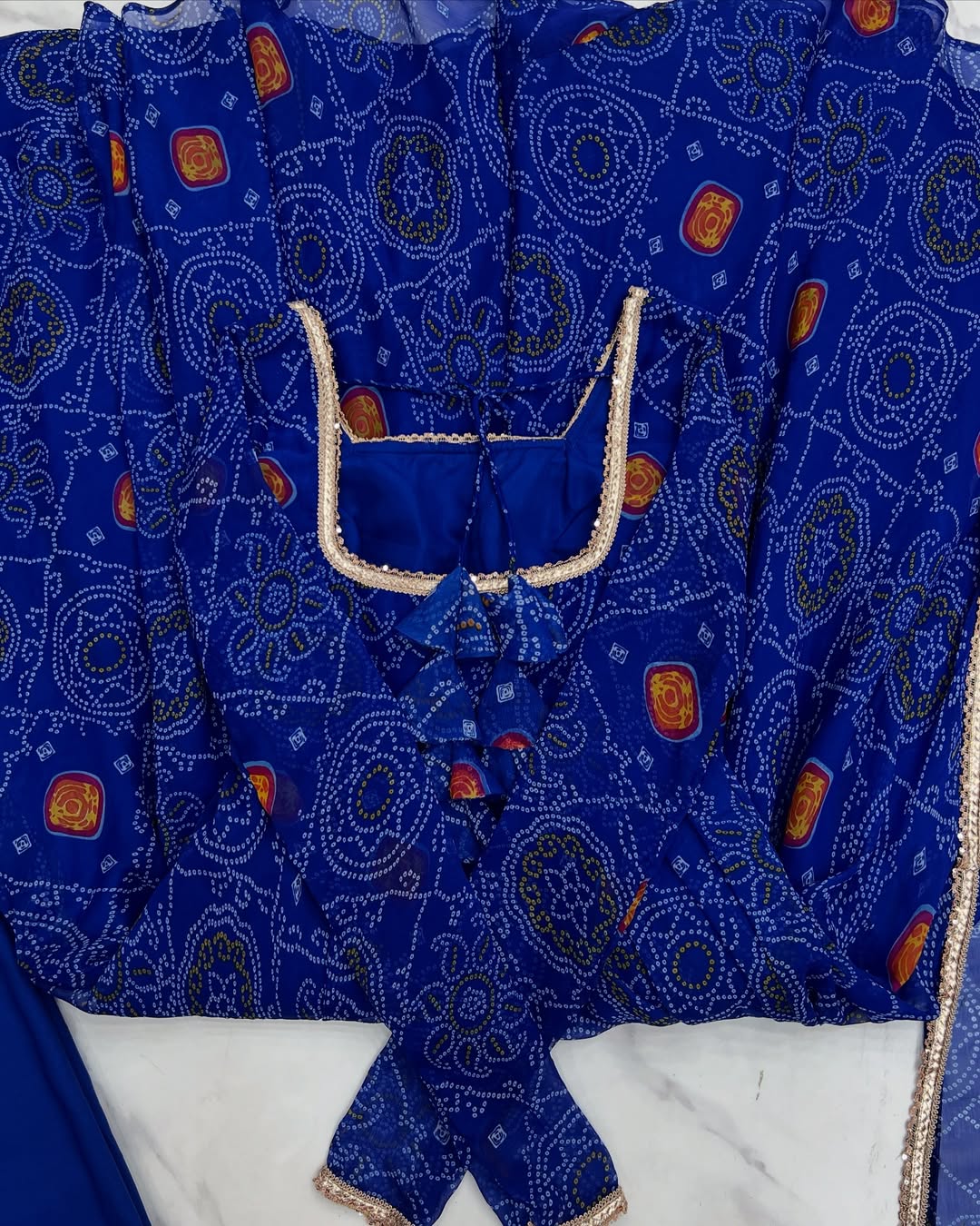 Shanvi Bandhej Chiffon Anarkali Suit Set – blue Bandhej Anarkali gown, traditional chiffon ethnic wear, women’s blue ethnic dress, Bandhej printed Anarkali for weddings, designer ethnic gown, Anarkali suit with lace dupatta, flair Anarkali with full sleeves, Bandhej print ethnic dress, blue festival wear gown, Indian wedding guest Anarkali.