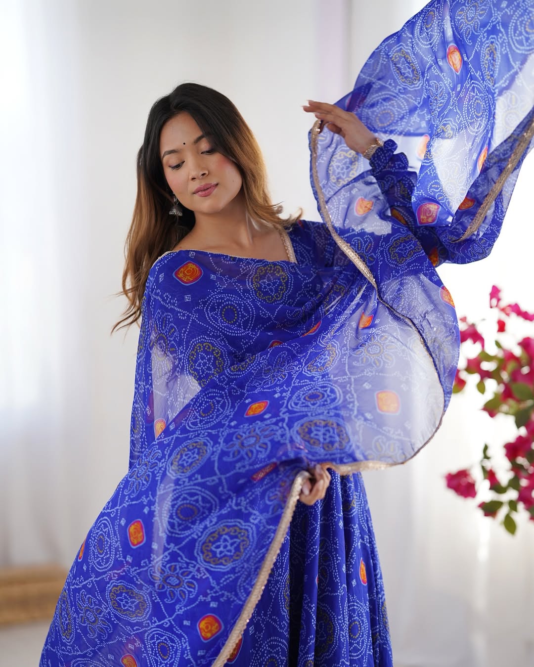 Shanvi Bandhej Chiffon Anarkali Suit Set – blue Bandhej Anarkali gown, traditional chiffon ethnic wear, women’s blue ethnic dress, Bandhej printed Anarkali for weddings, designer ethnic gown, Anarkali suit with lace dupatta, flair Anarkali with full sleeves, Bandhej print ethnic dress, blue festival wear gown, Indian wedding guest Anarkali.