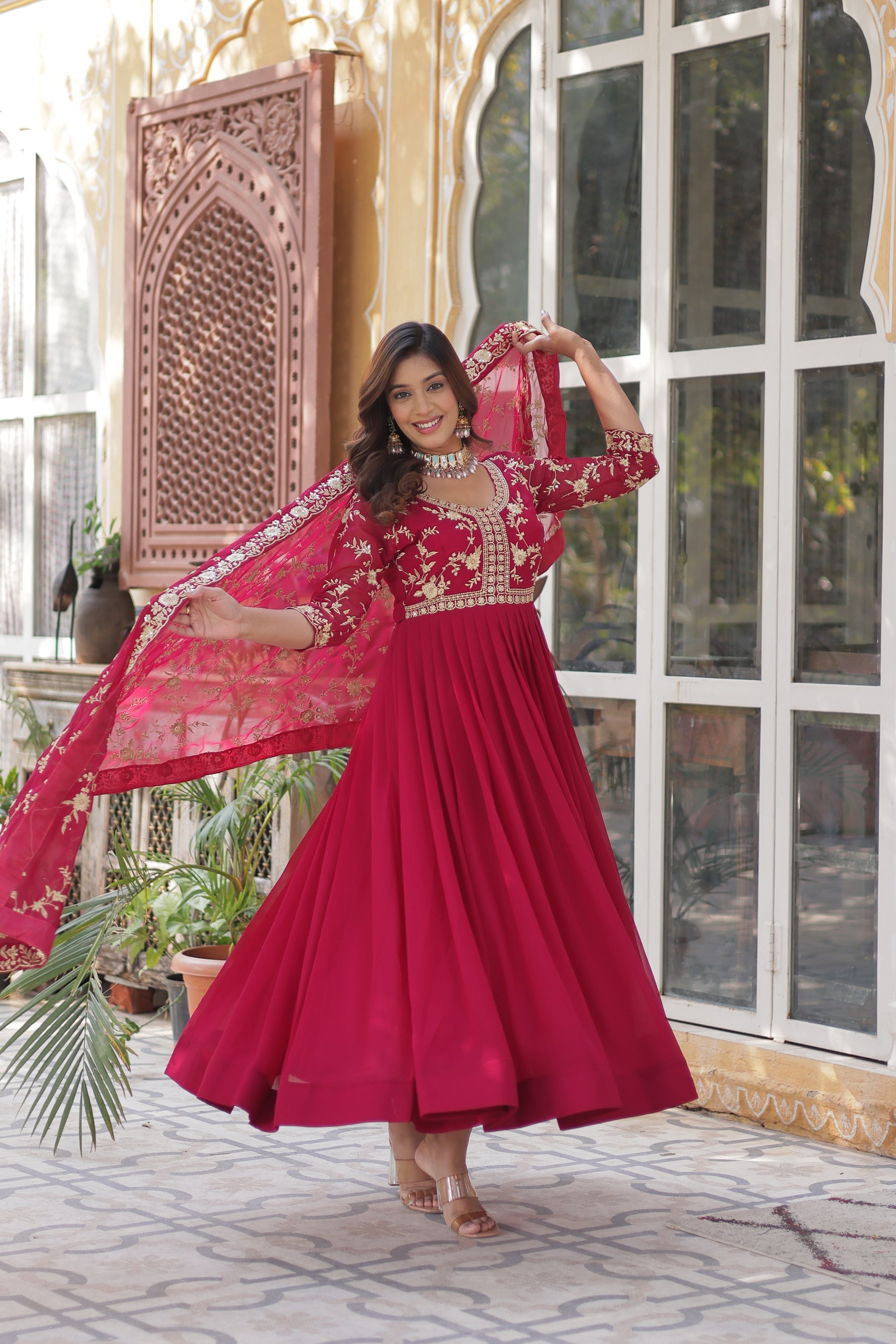  Shivangi pink embroidered Anarkali gown set made from faux blooming fabric with zari and multi-sequins work, featuring 3/4th sleeves and a designer neckline, paired with matching embroidered dupatta – perfect ethnic outfit for weddings, festivals, and special occasions in 2025.