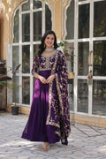  Shivangi purple embroidered Anarkali gown set featuring faux blooming fabric, zari and multi-sequins work, 3/4 sleeves, and a designer neck, paired with embroidered faux georgette dupatta – ideal ethnic outfit for weddings, festivals, and party wear in 2025.