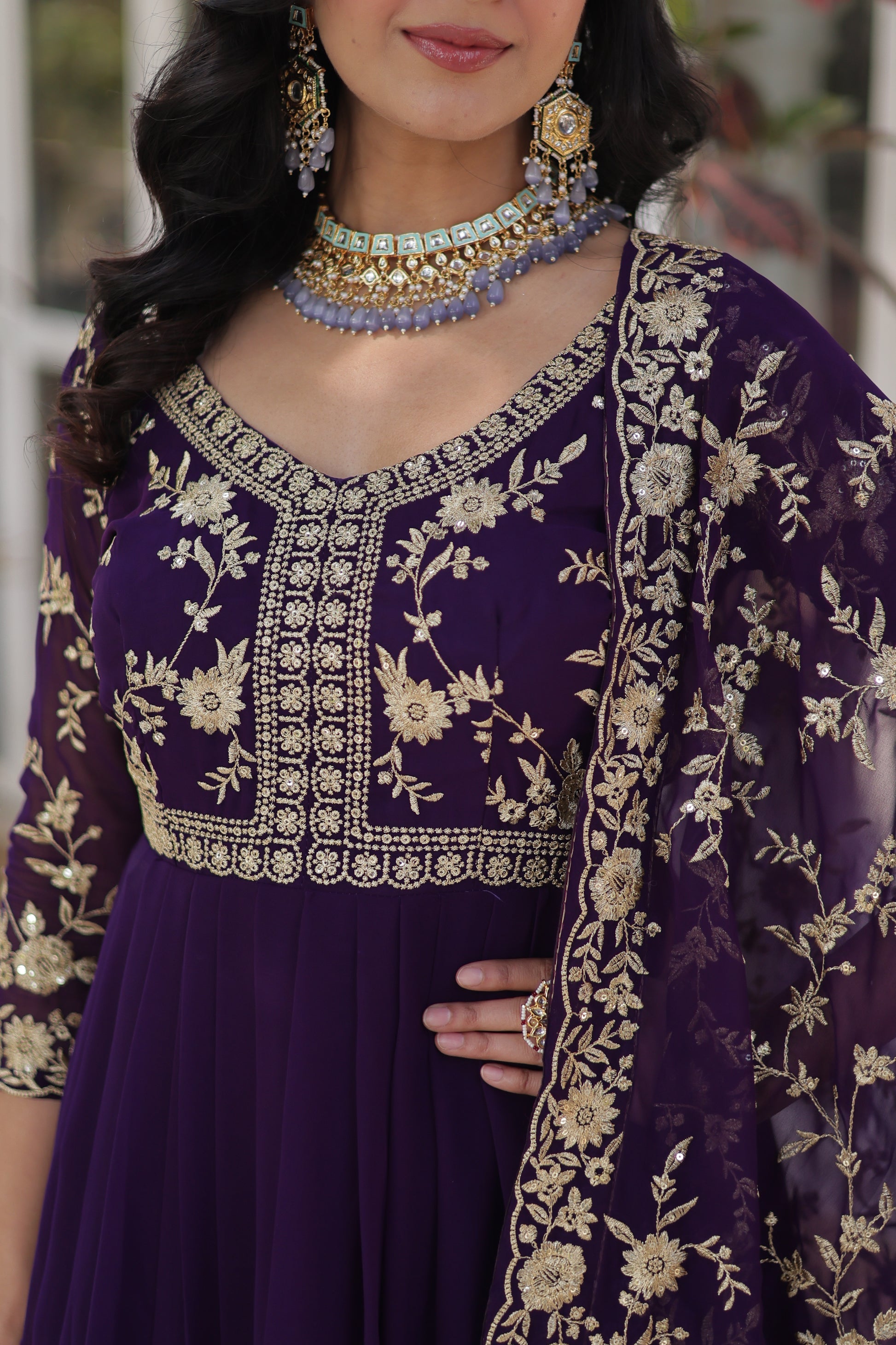  Shivangi purple embroidered Anarkali gown set featuring faux blooming fabric, zari and multi-sequins work, 3/4 sleeves, and a designer neck, paired with embroidered faux georgette dupatta – ideal ethnic outfit for weddings, festivals, and party wear in 2025.