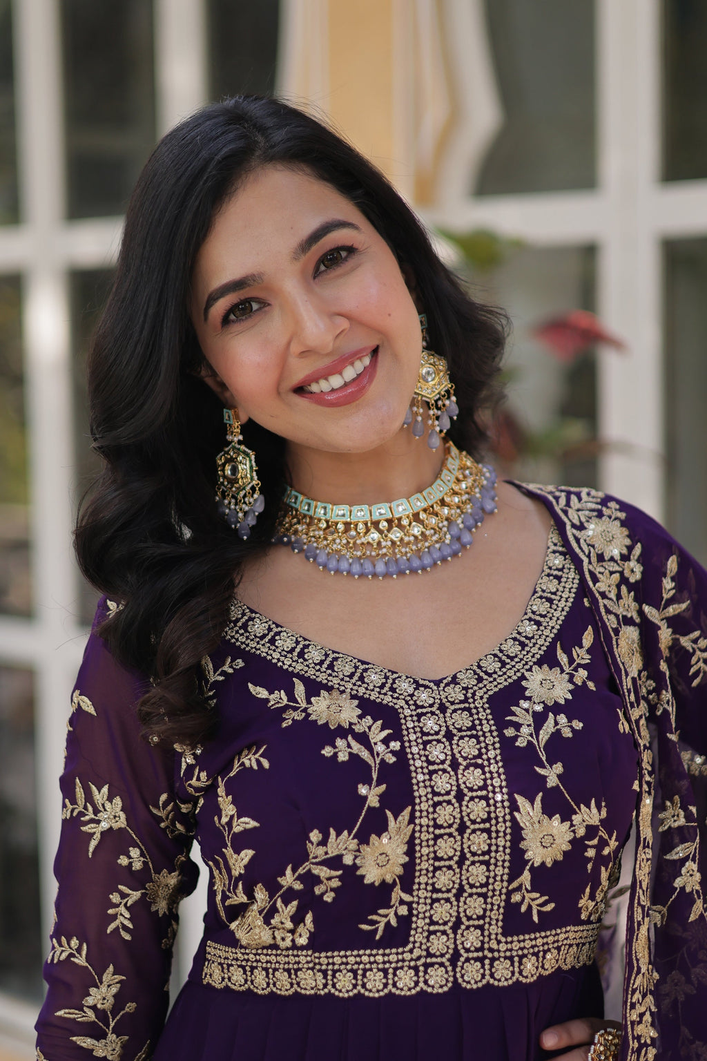  Shivangi purple embroidered Anarkali gown set featuring faux blooming fabric, zari and multi-sequins work, 3/4 sleeves, and a designer neck, paired with embroidered faux georgette dupatta – ideal ethnic outfit for weddings, festivals, and party wear in 2025.