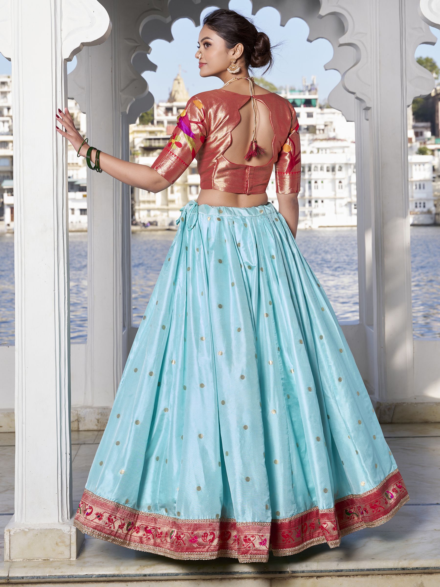 Sky Blue Jacquard Silk Paithani Lehenga Choli with zari weaving, lace accents, tassel dupatta, and matching batwa – traditional Maharashtrian festive attire