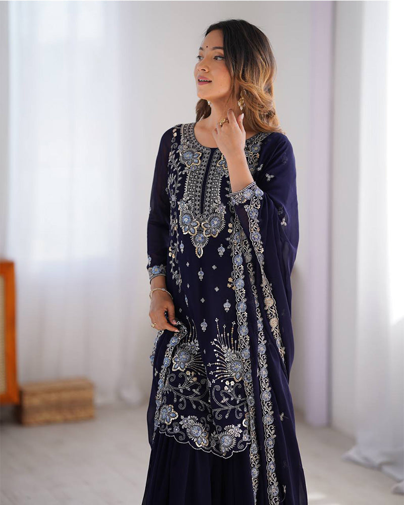Tanvisha blue embroidered sharara suit set featuring faux georgette fabric with thread and sequin embroidery on top, sharara pants, and a dupatta with lace border – perfect for weddings, festive occasions, and luxury ethnic wear 