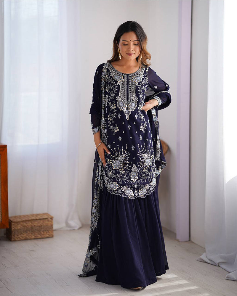 Tanvisha blue embroidered sharara suit set featuring faux georgette fabric with thread and sequin embroidery on top, sharara pants, and a dupatta with lace border – perfect for weddings, festive occasions, and luxury ethnic wear 