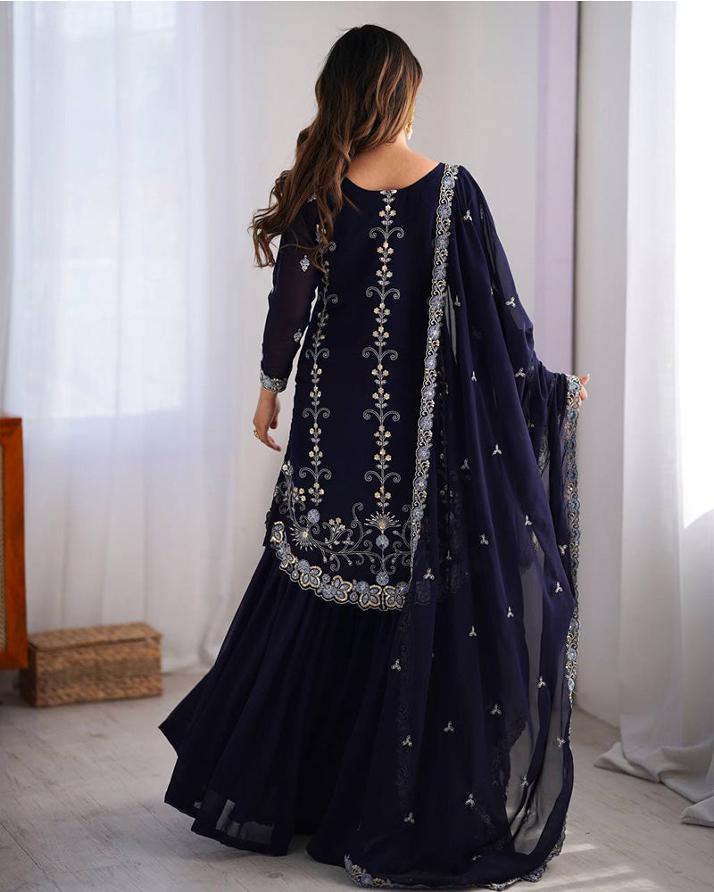 Tanvisha blue embroidered sharara suit set featuring faux georgette fabric with thread and sequin embroidery on top, sharara pants, and a dupatta with lace border – perfect for weddings, festive occasions, and luxury ethnic wear 