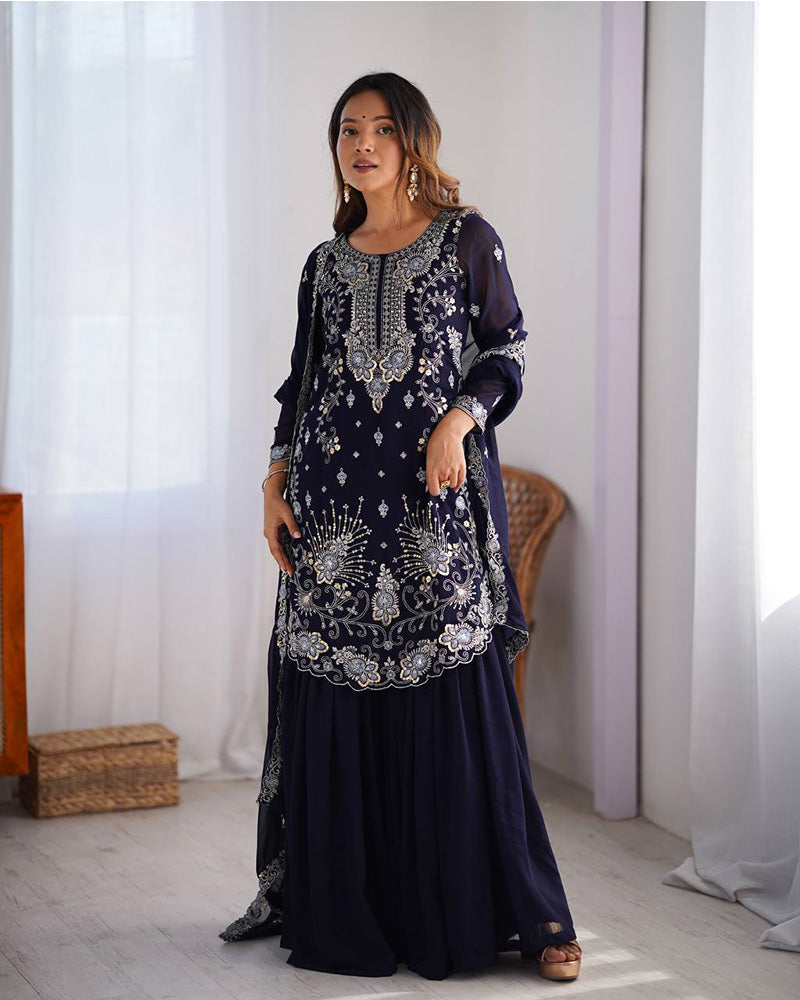 Tanvisha blue embroidered sharara suit set featuring faux georgette fabric with thread and sequin embroidery on top, sharara pants, and a dupatta with lace border – perfect for weddings, festive occasions, and luxury ethnic wear 