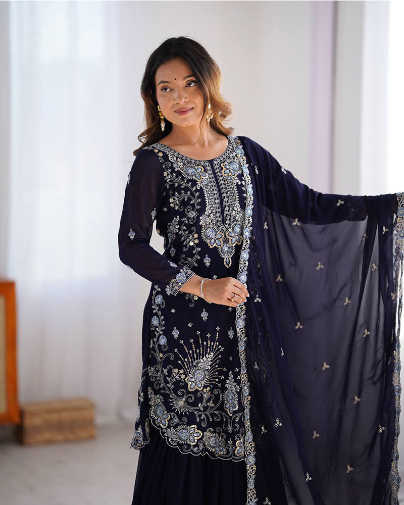 Tanvisha blue embroidered sharara suit set featuring faux georgette fabric with thread and sequin embroidery on top, sharara pants, and a dupatta with lace border – perfect for weddings, festive occasions, and luxury ethnic wear 