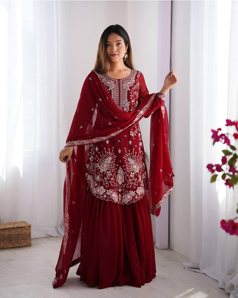 Tanvisha maroon embroidered sharara suit set featuring faux georgette fabric with thread and sequin embroidery on top, sharara pants, and a dupatta with lace border – perfect for weddings, festive occasions, and luxury ethnic wear 
