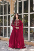 The **Tarakini Pink Embroidered Anarkali Gown Set** is a stunning blend of tradition and modern elegance, designed for grand occasions like weddings, festive celebrations, and parties. Crafted from **premium faux blooming georgette**, this **designer Anarkali gown** features intricate embroidery, a voluminous 3.5-meter flair, and a soft cotton lining for all-day comfort. 

With its **floor-length silhouette (56 inches), full sleeves, and classic round neck**, this heavy embroidered gown ensures a regal pres