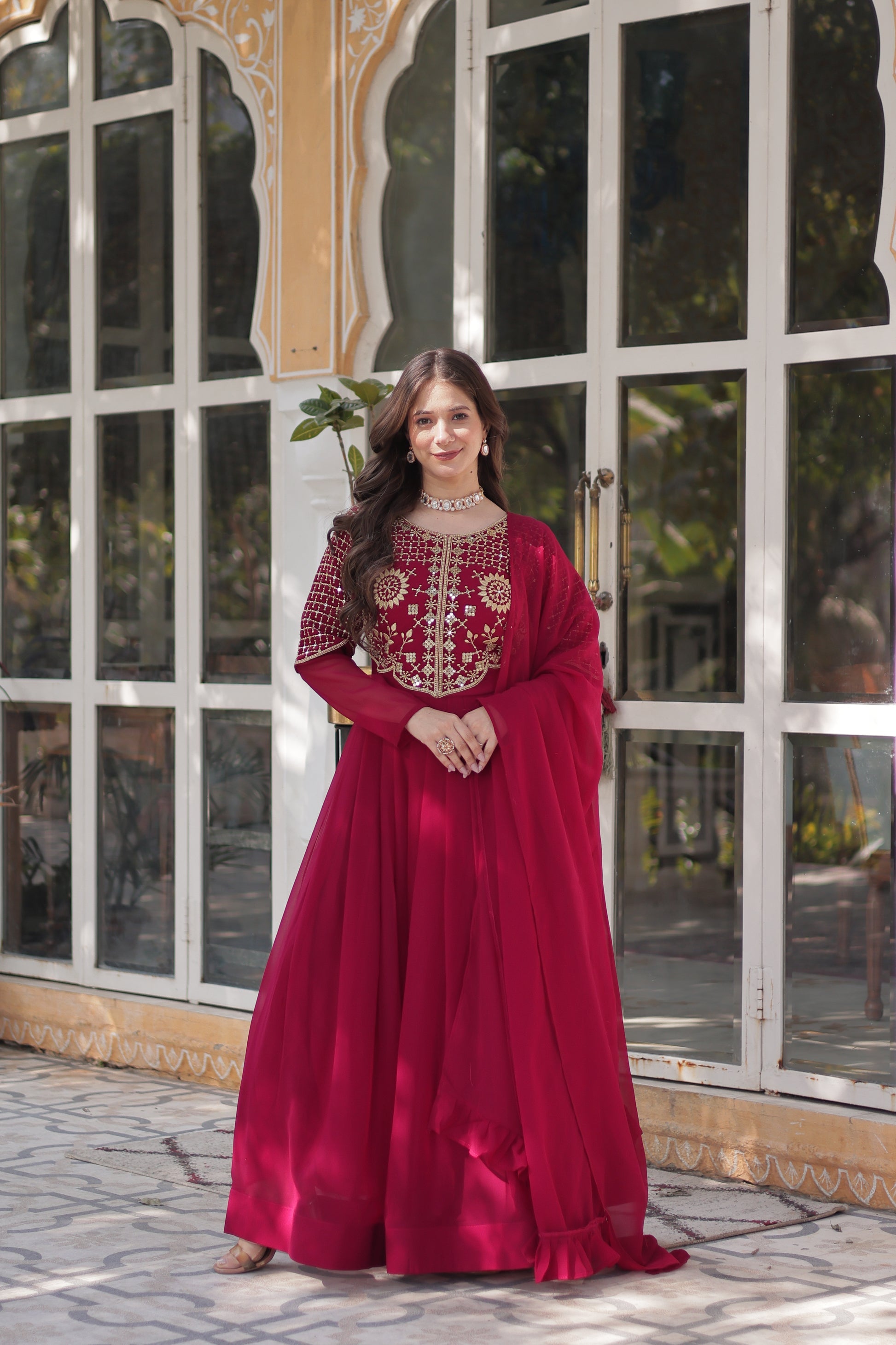 The **Tarakini Pink Embroidered Anarkali Gown Set** is a stunning blend of tradition and modern elegance, designed for grand occasions like weddings, festive celebrations, and parties. Crafted from **premium faux blooming georgette**, this **designer Anarkali gown** features intricate embroidery, a voluminous 3.5-meter flair, and a soft cotton lining for all-day comfort. 

With its **floor-length silhouette (56 inches), full sleeves, and classic round neck**, this heavy embroidered gown ensures a regal pres