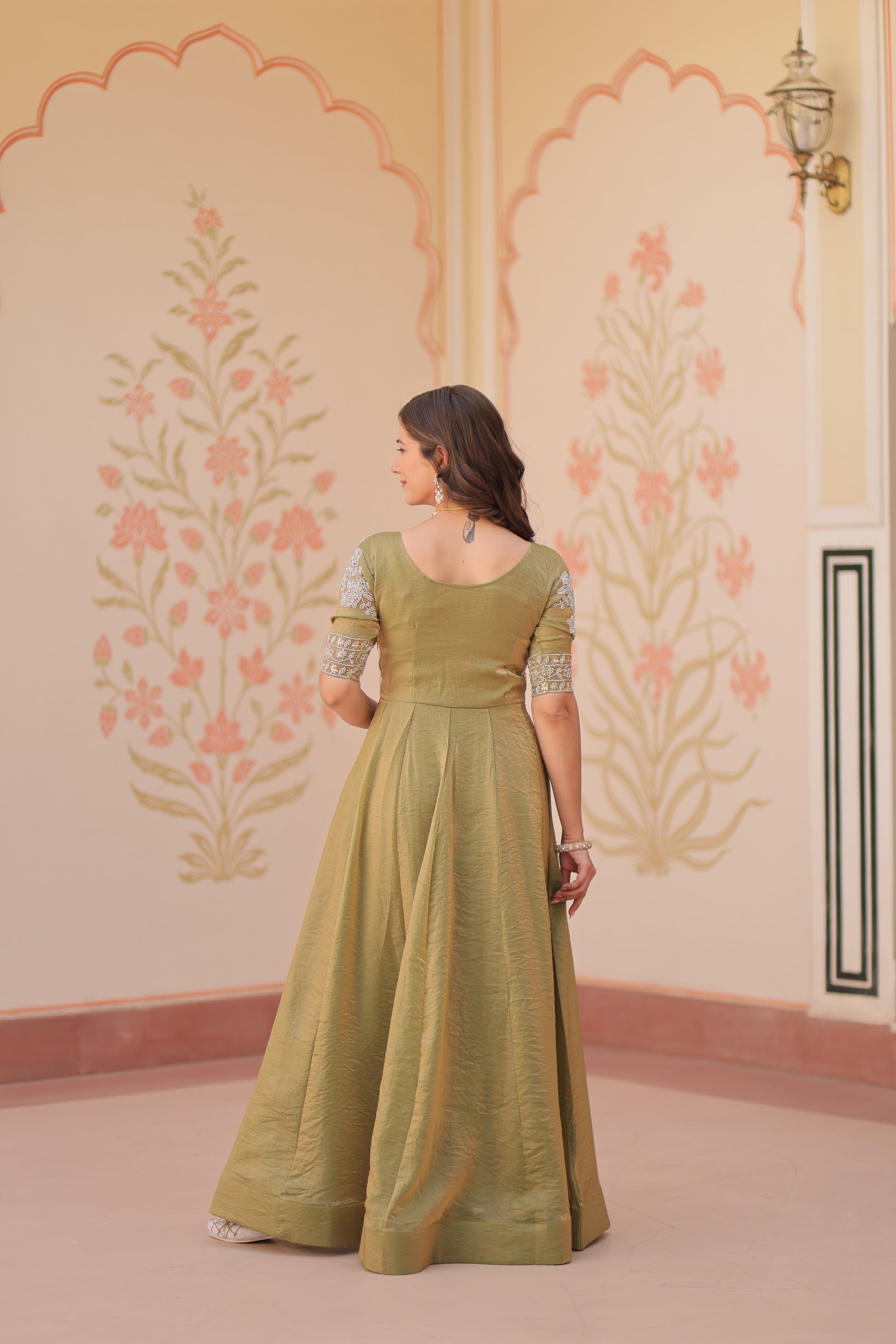 Vaibhavi Pista Green Gown in Fendy Silk with beads embroidery, 3.5m flair & boat neck – a graceful, fully-stitched festive outfit.