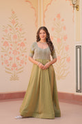 Vaibhavi Pista Green Gown in Fendy Silk with beads embroidery, 3.5m flair & boat neck – a graceful, fully-stitched festive outfit.