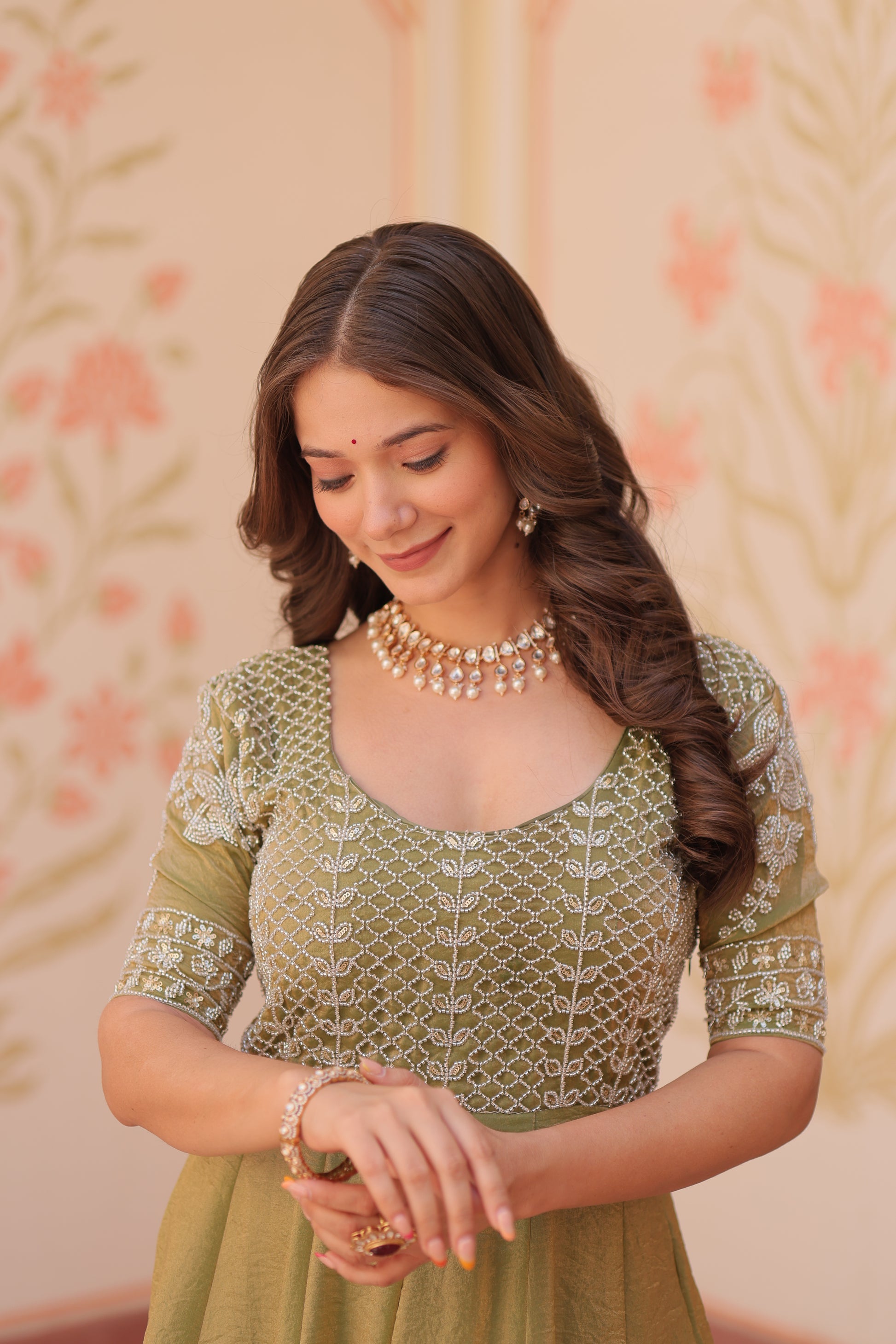 Vaibhavi Pista Green Gown in Fendy Silk with beads embroidery, 3.5m flair & boat neck – a graceful, fully-stitched festive outfit.