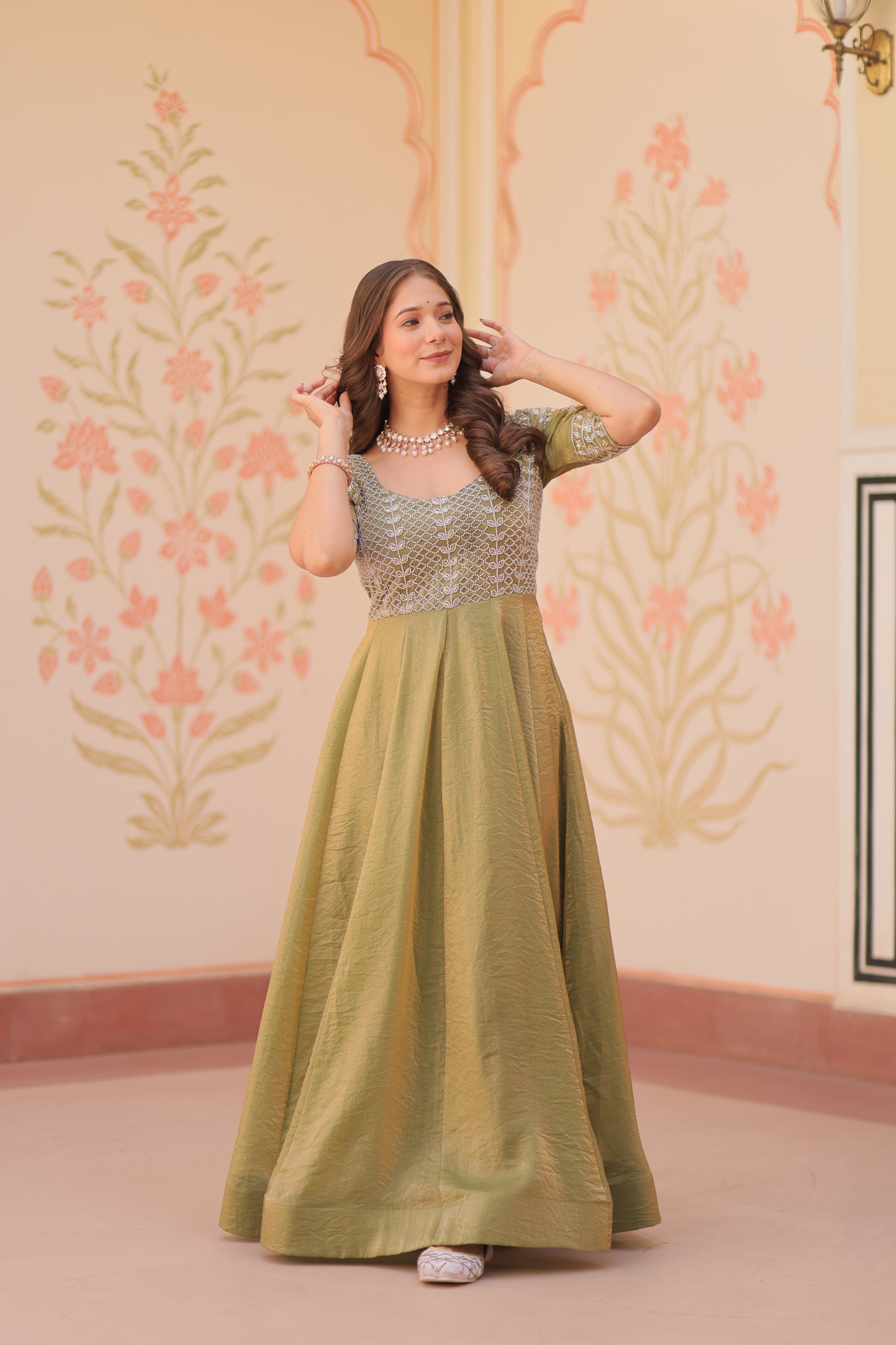 Vaibhavi Pista Green Gown in Fendy Silk with beads embroidery, 3.5m flair & boat neck – a graceful, fully-stitched festive outfit.