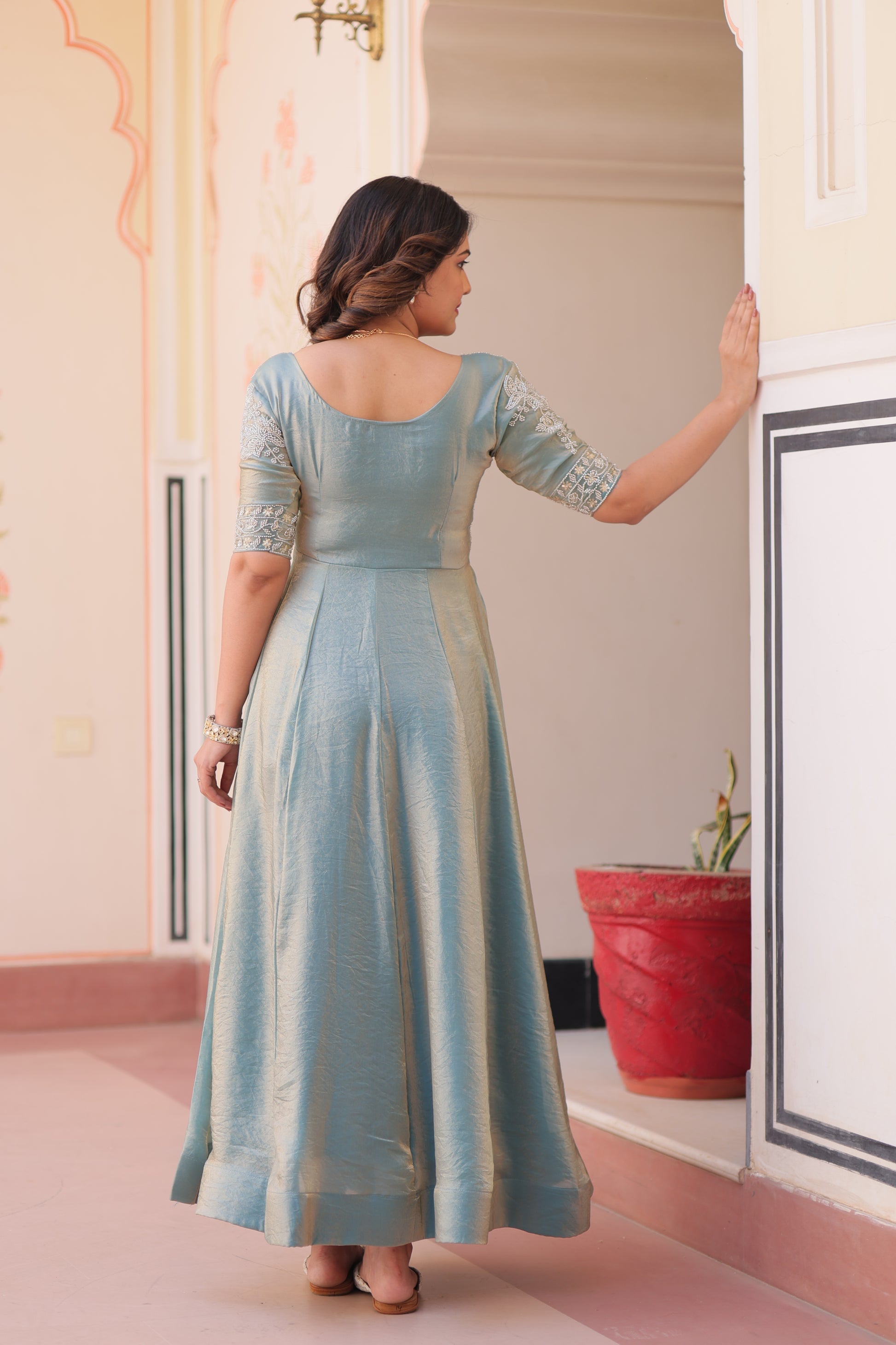 Vaibhavi Sky Blue Gown in Fendy Silk with beads embroidery, 3.5m flair & boat neck – fully stitched elegance for festive occasions.
