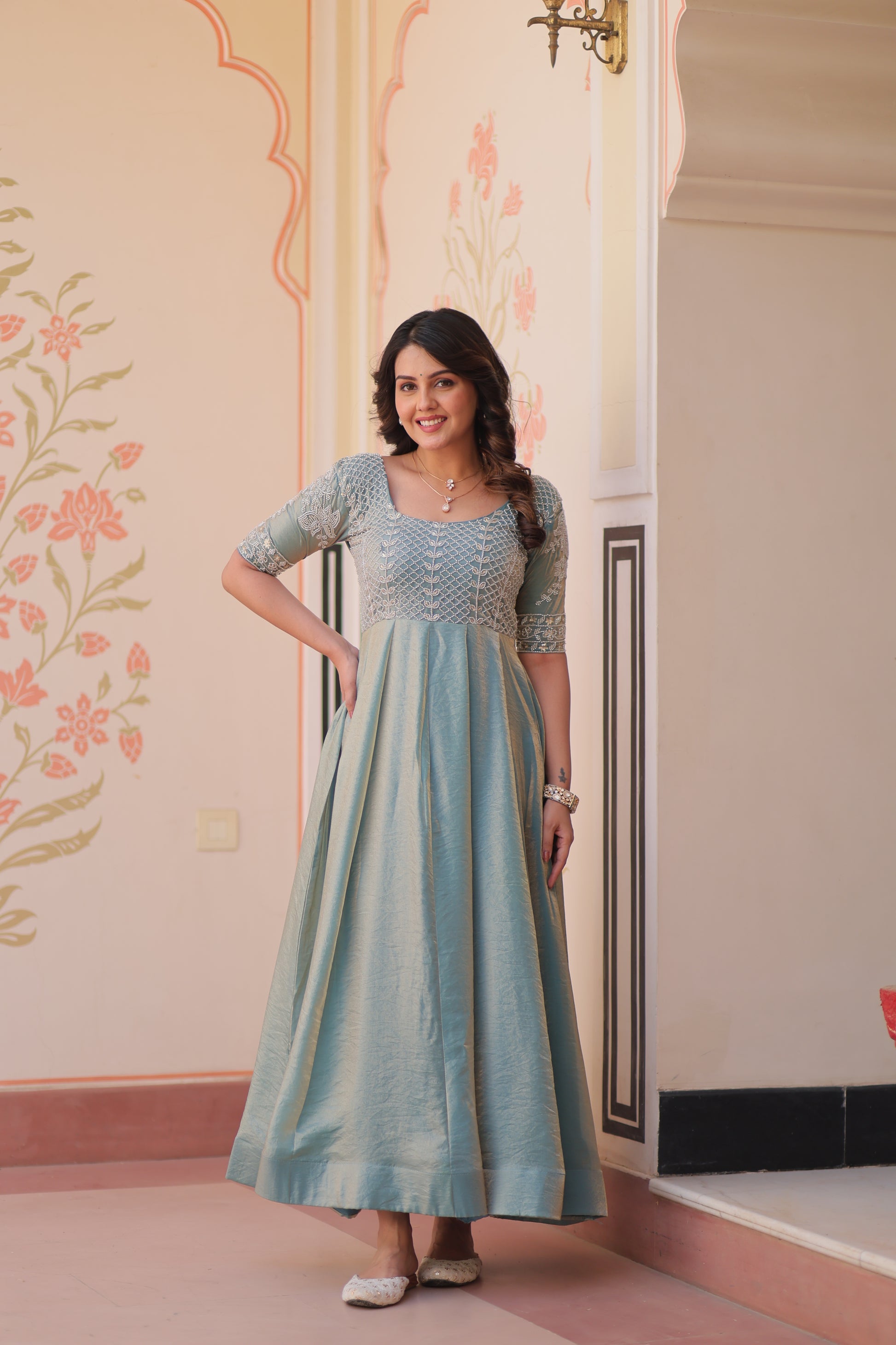 Vaibhavi Sky Blue Gown in Fendy Silk with beads embroidery, 3.5m flair & boat neck – fully stitched elegance for festive occasions.