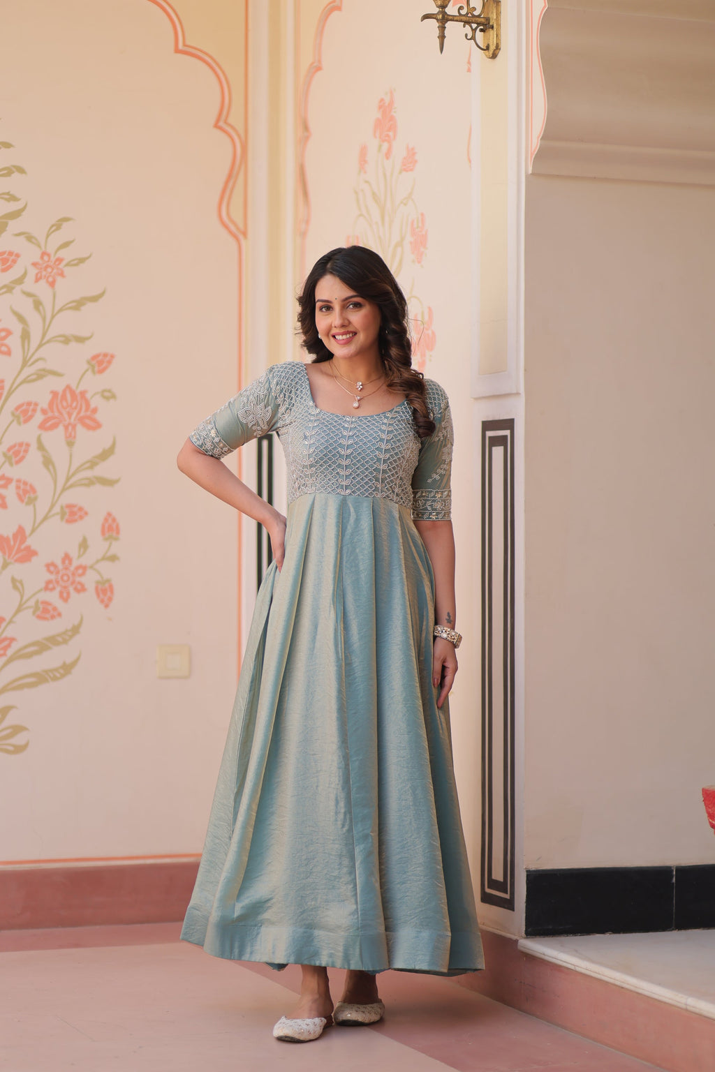 Vaibhavi Sky Blue Gown in Fendy Silk with beads embroidery, 3.5m flair & boat neck – fully stitched elegance for festive occasions.