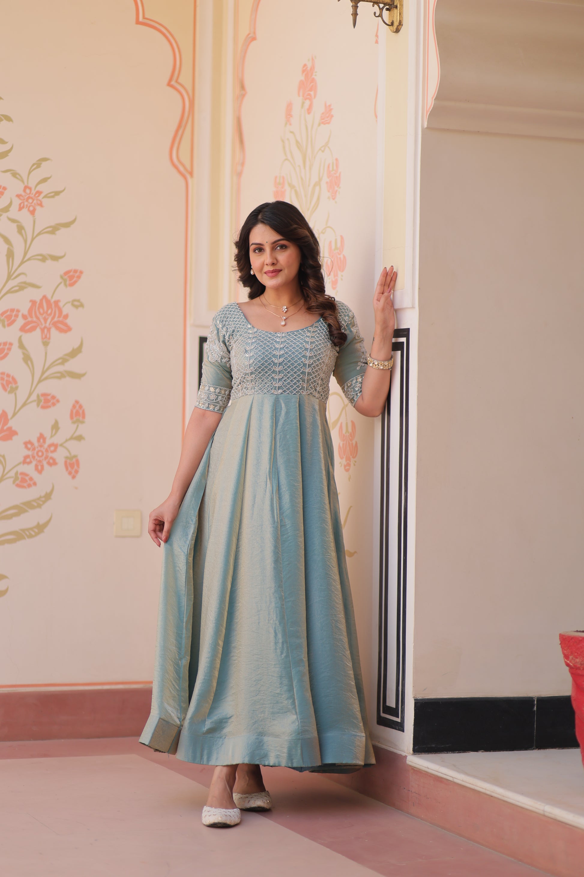 Vaibhavi Sky Blue Gown in Fendy Silk with beads embroidery, 3.5m flair & boat neck – fully stitched elegance for festive occasions.