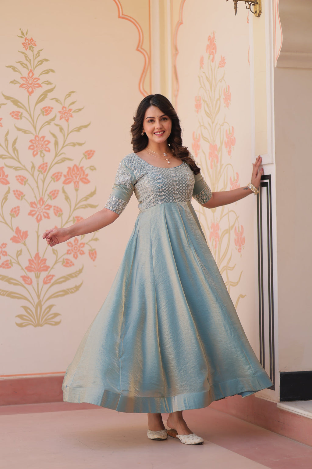 Vaibhavi Sky Blue Gown in Fendy Silk with beads embroidery, 3.5m flair & boat neck – fully stitched elegance for festive occasions.