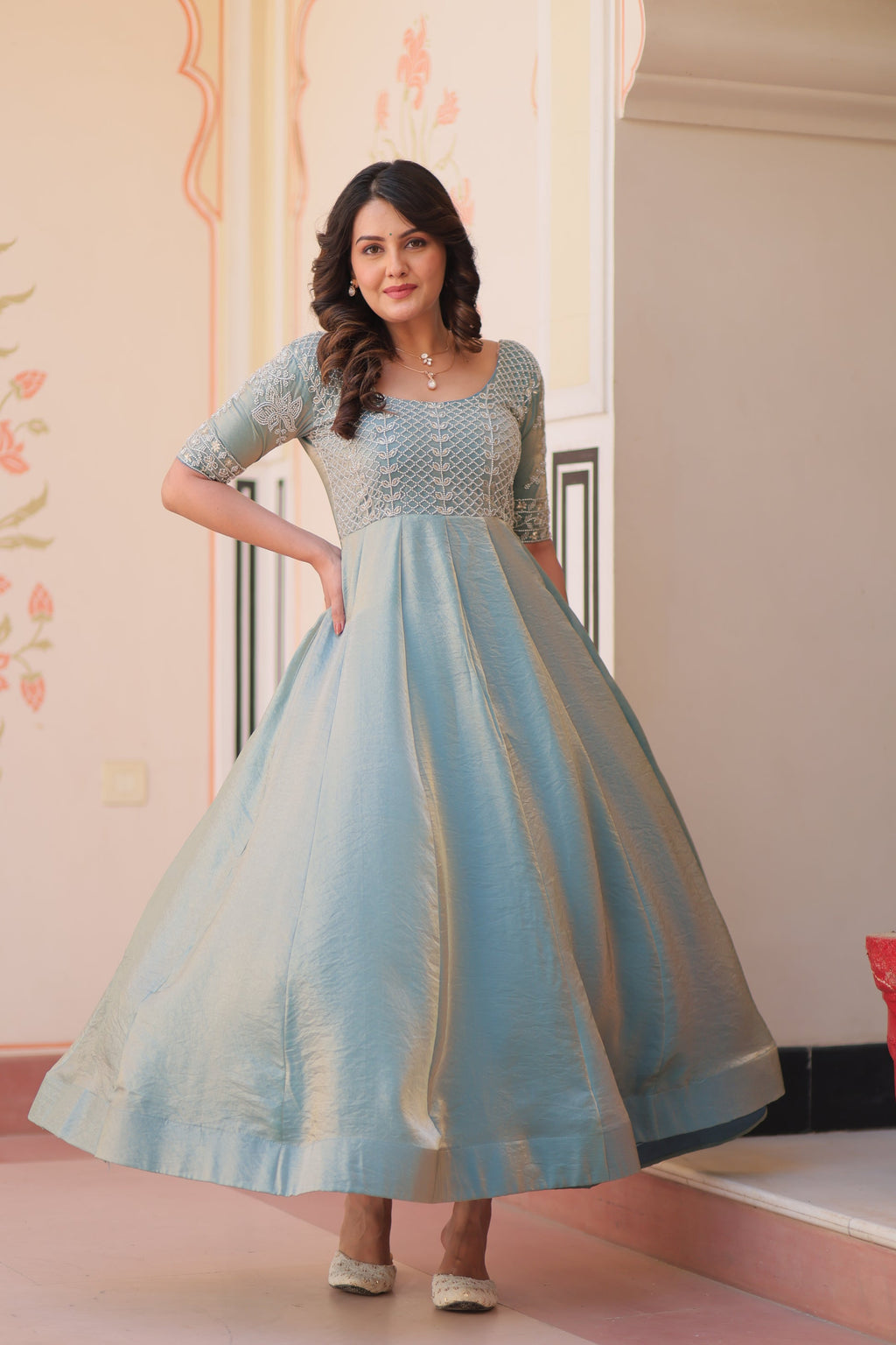 Vaibhavi Sky Blue Gown in Fendy Silk with beads embroidery, 3.5m flair & boat neck – fully stitched elegance for festive occasions.
