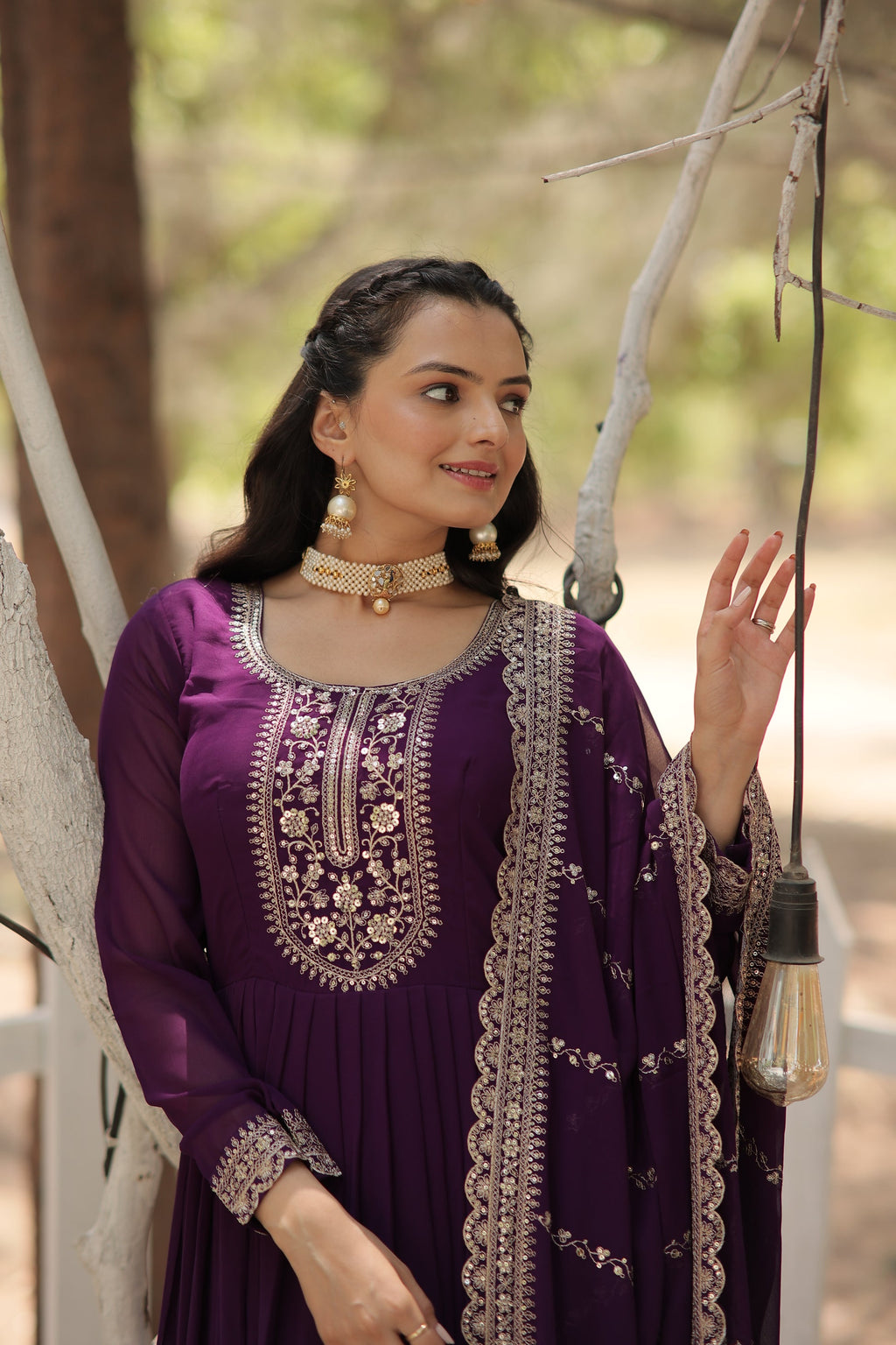 Vasundhara purple faux blooming Anarkali gown suit set