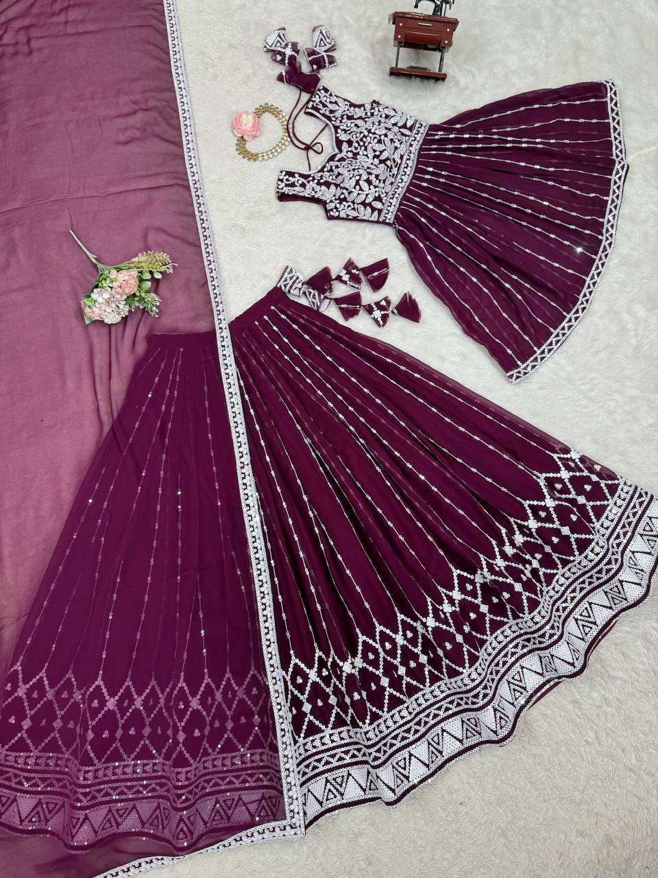 Wine coloured georgette sequin embroidered lehenga with top
