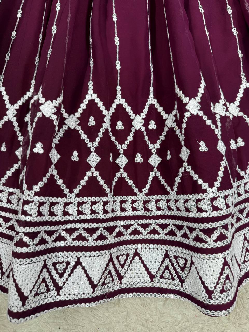 Wine coloured georgette sequin embroidered lehenga with top