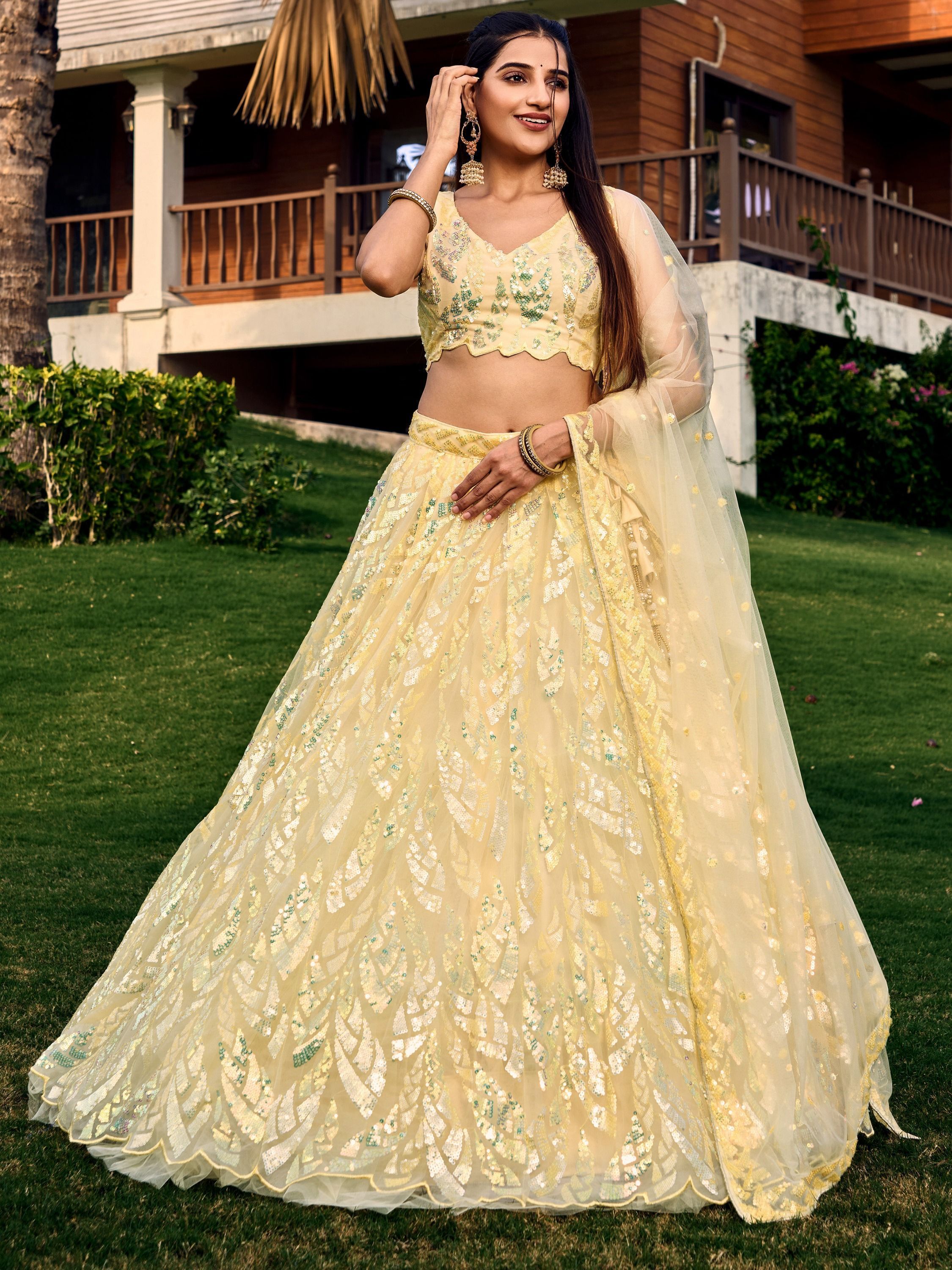 Yellow soft net lehenga choli with heavy multi sequins embroidery and lace border dupatta perfect for weddings receptions and glam parties